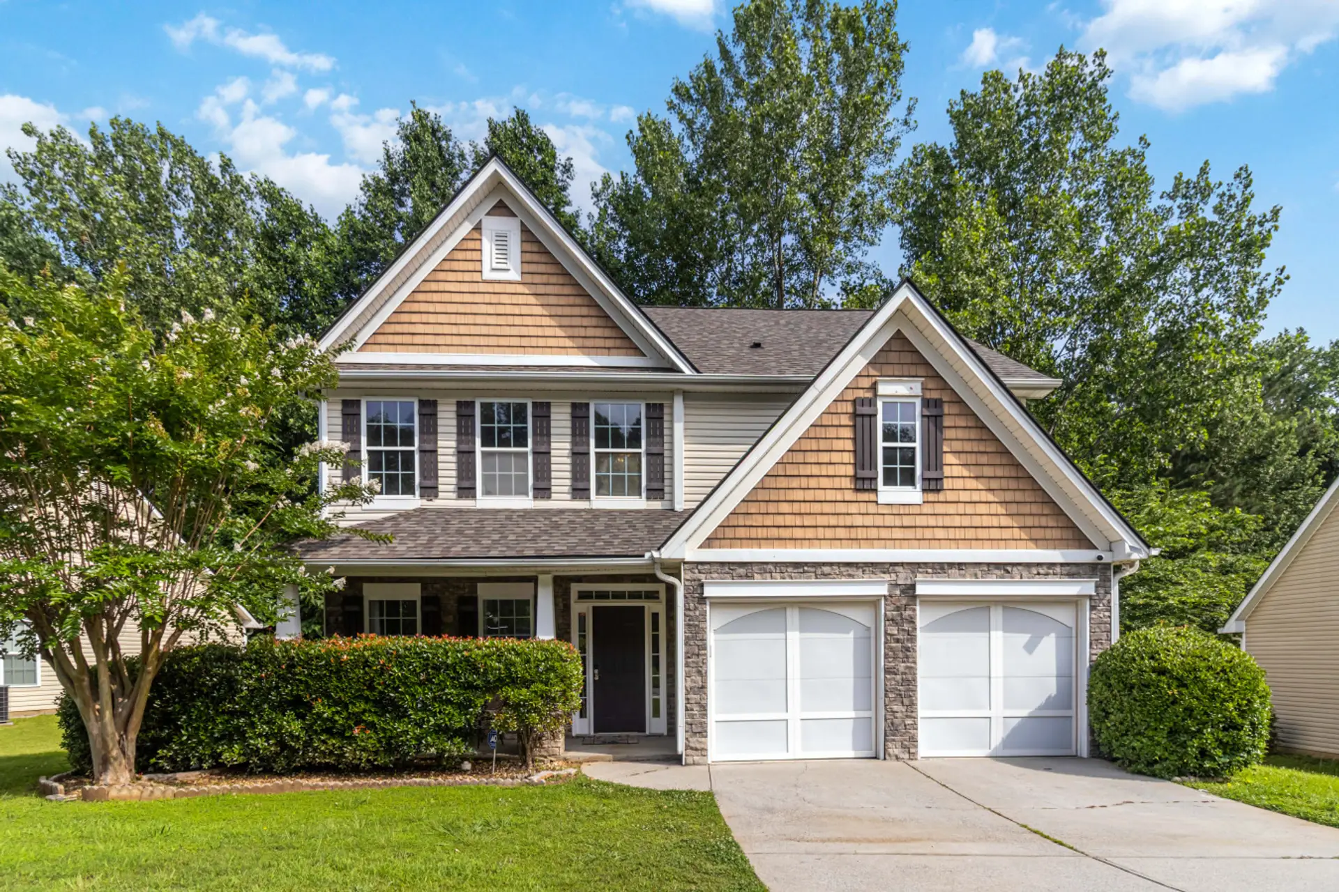 Front view with parking available on the driveway and in the garage.