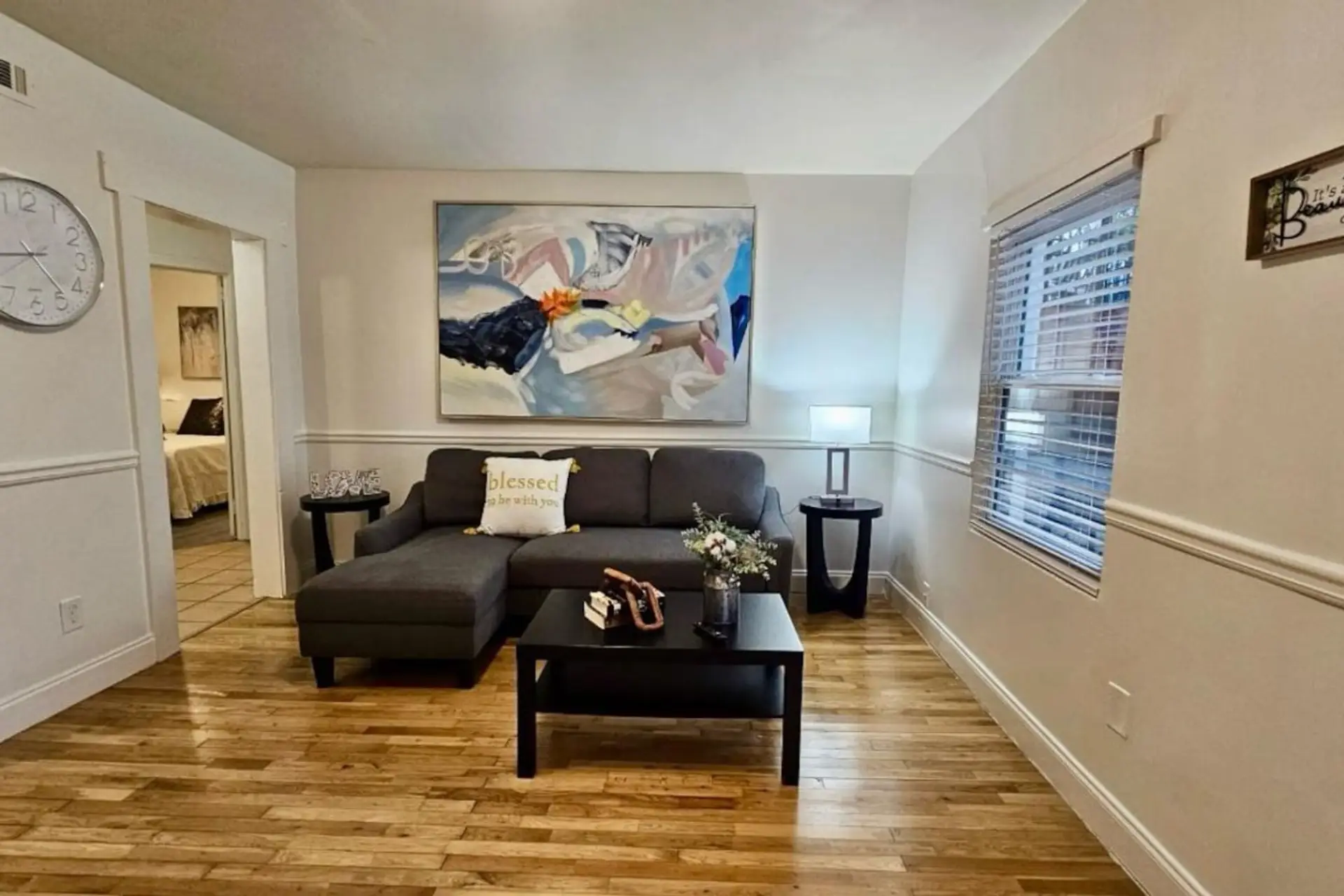 See the living room—perfect for relaxation and family bonding, complete with a cozy setup and a smart TV for entertainment.