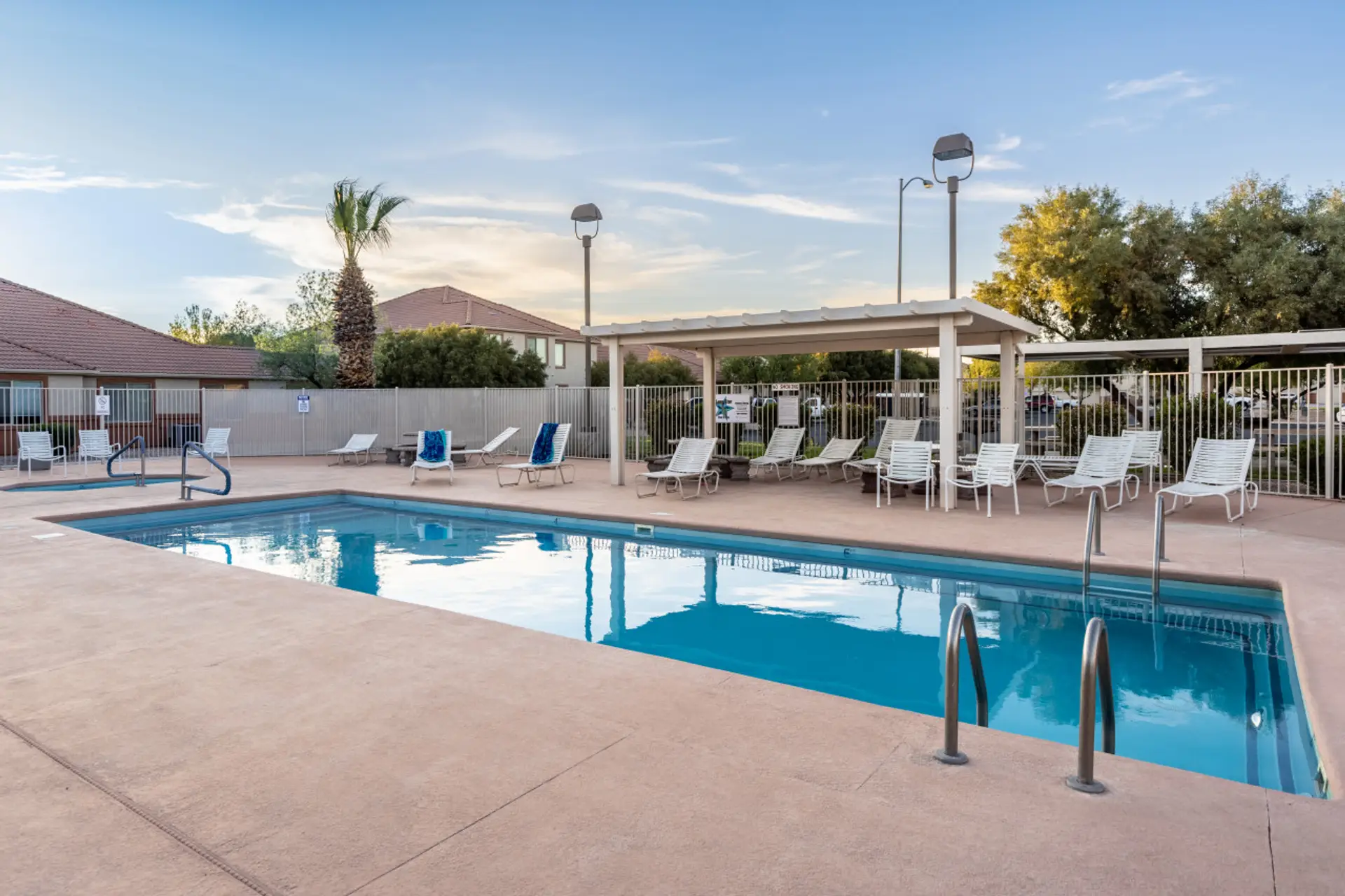 Large community pool with loungers.