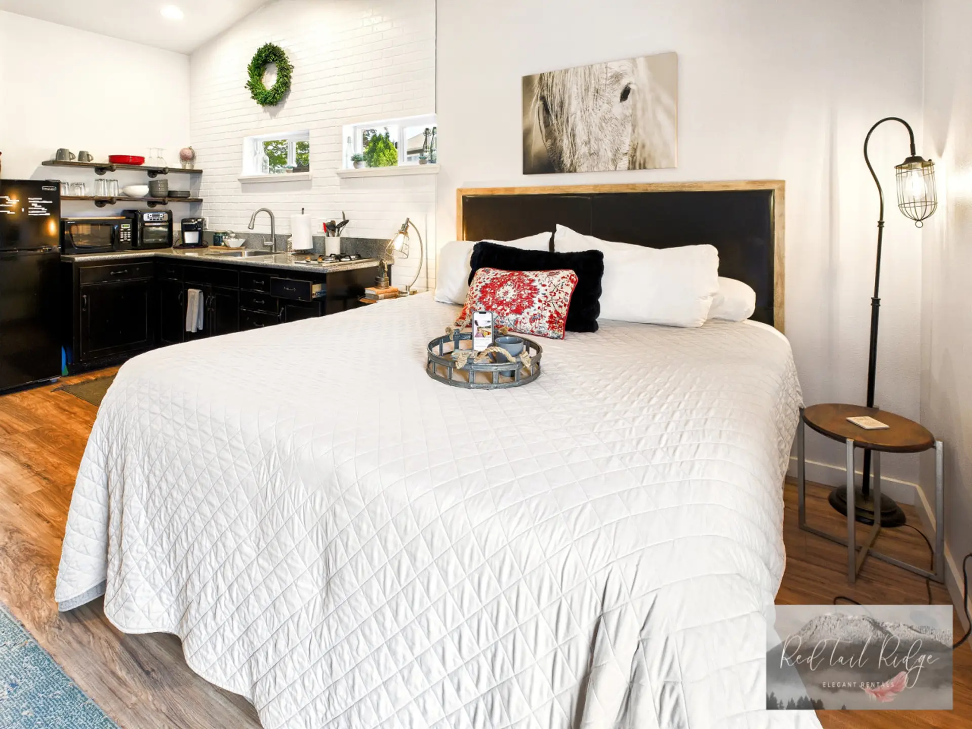 Wake up refreshed in this cozy loft bedroom with modern rustic charm.