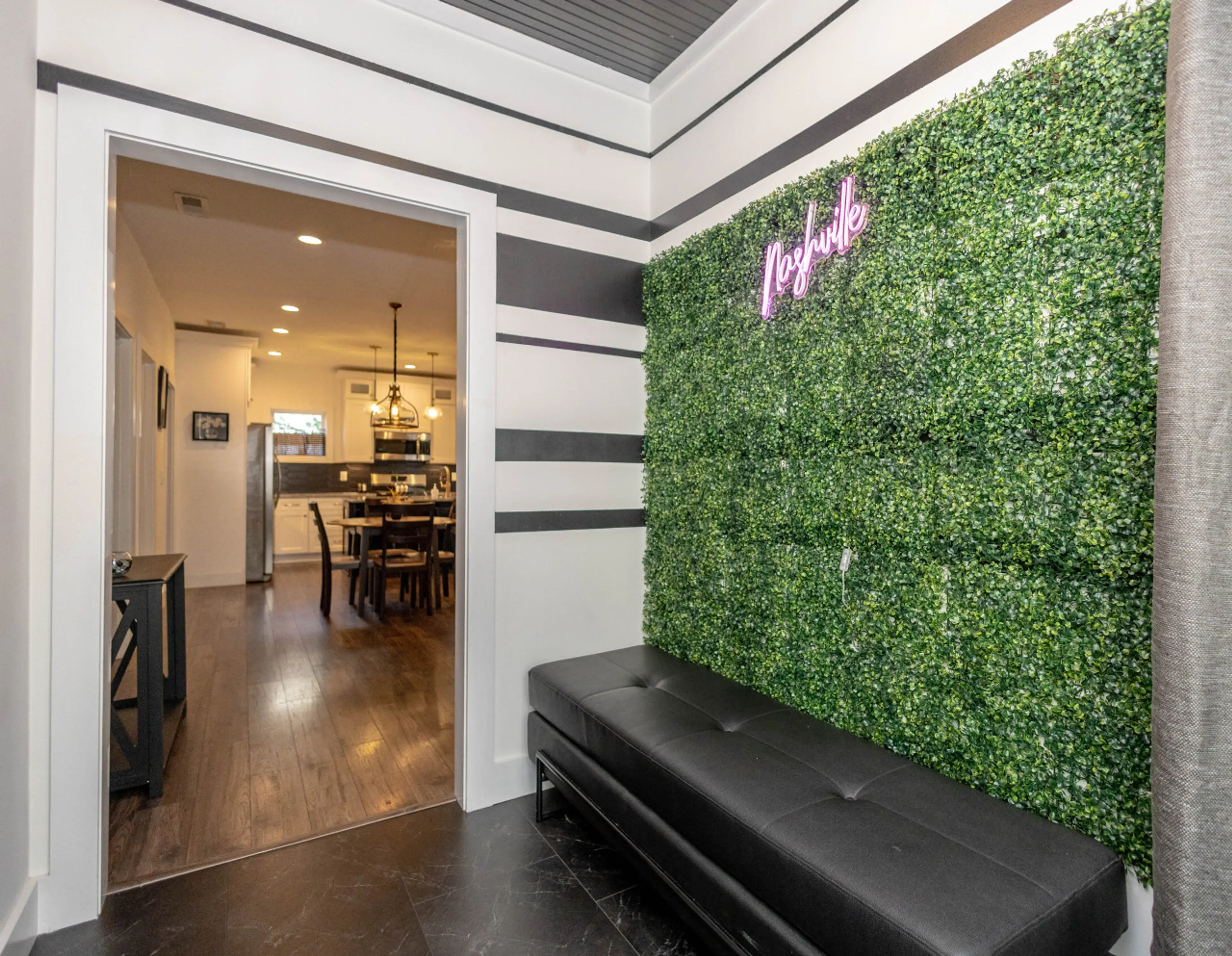 A closer look at our unique "Nashville" photo-op wall, complete with a bench for group pictures and great natural light from the nearby window.