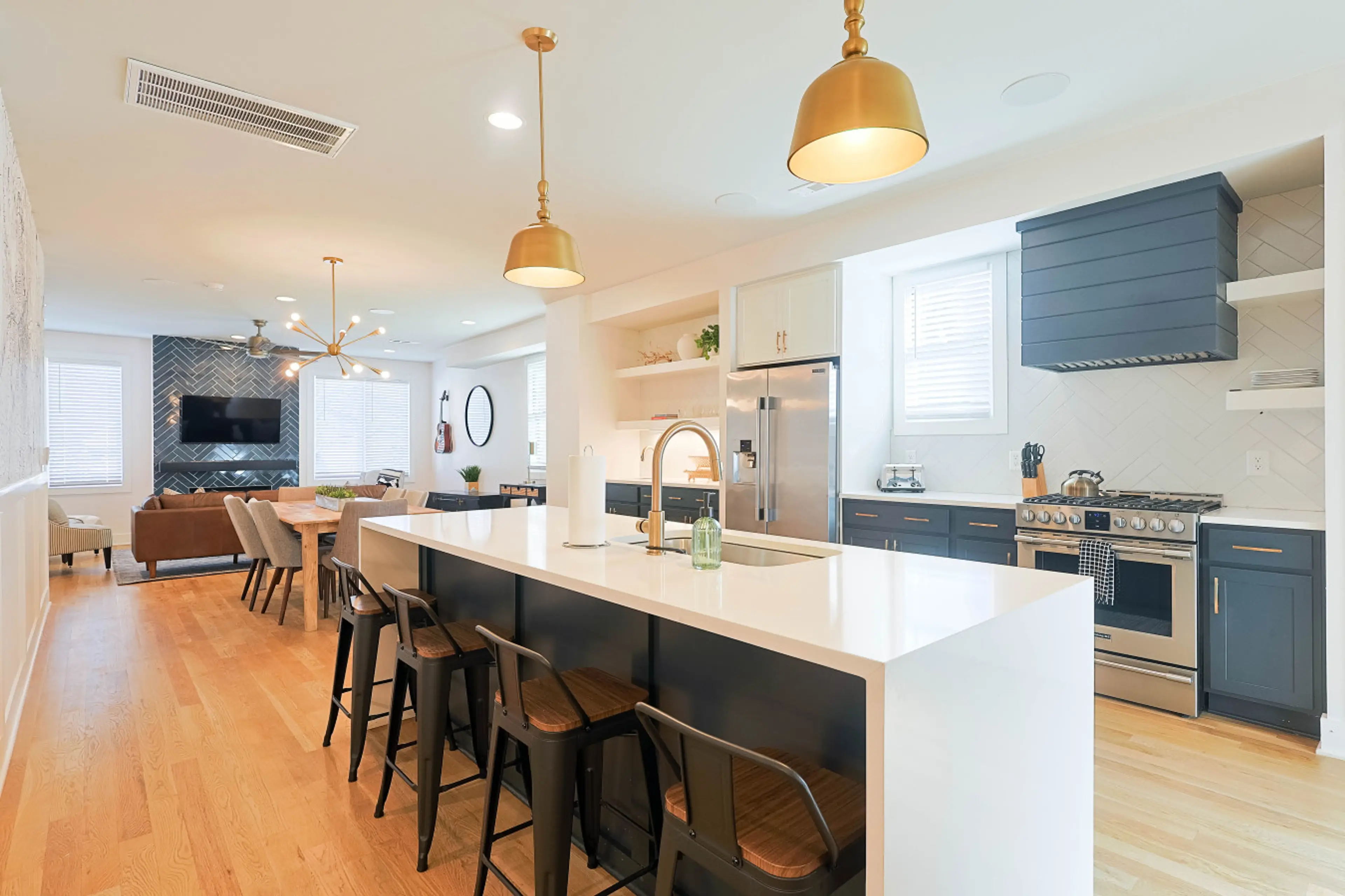 View from the kitchen island, showcasing the effortless connection between the cooking, dining, and main living spaces.
