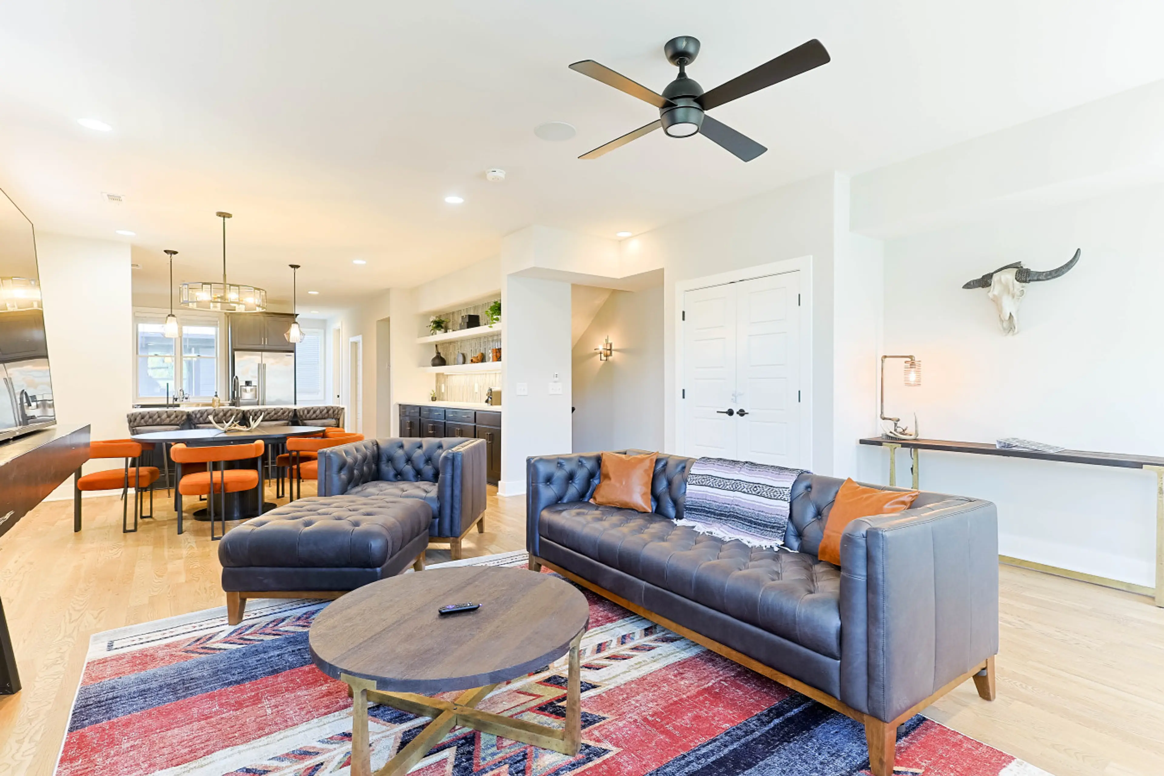 Bright, open living space with comfy seating and smart TV — perfect for group hangs