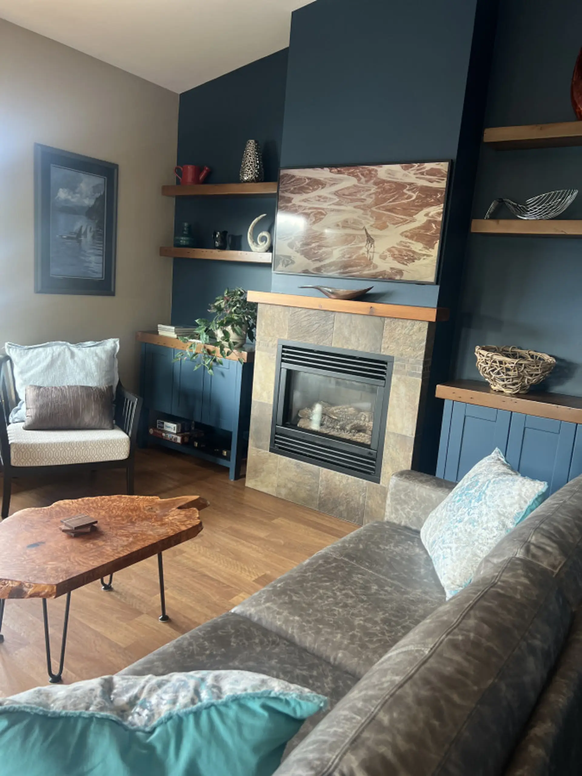 Living room with custom built cabinets and coffee table from refurbished cedar. Lay back and enjoy the view!