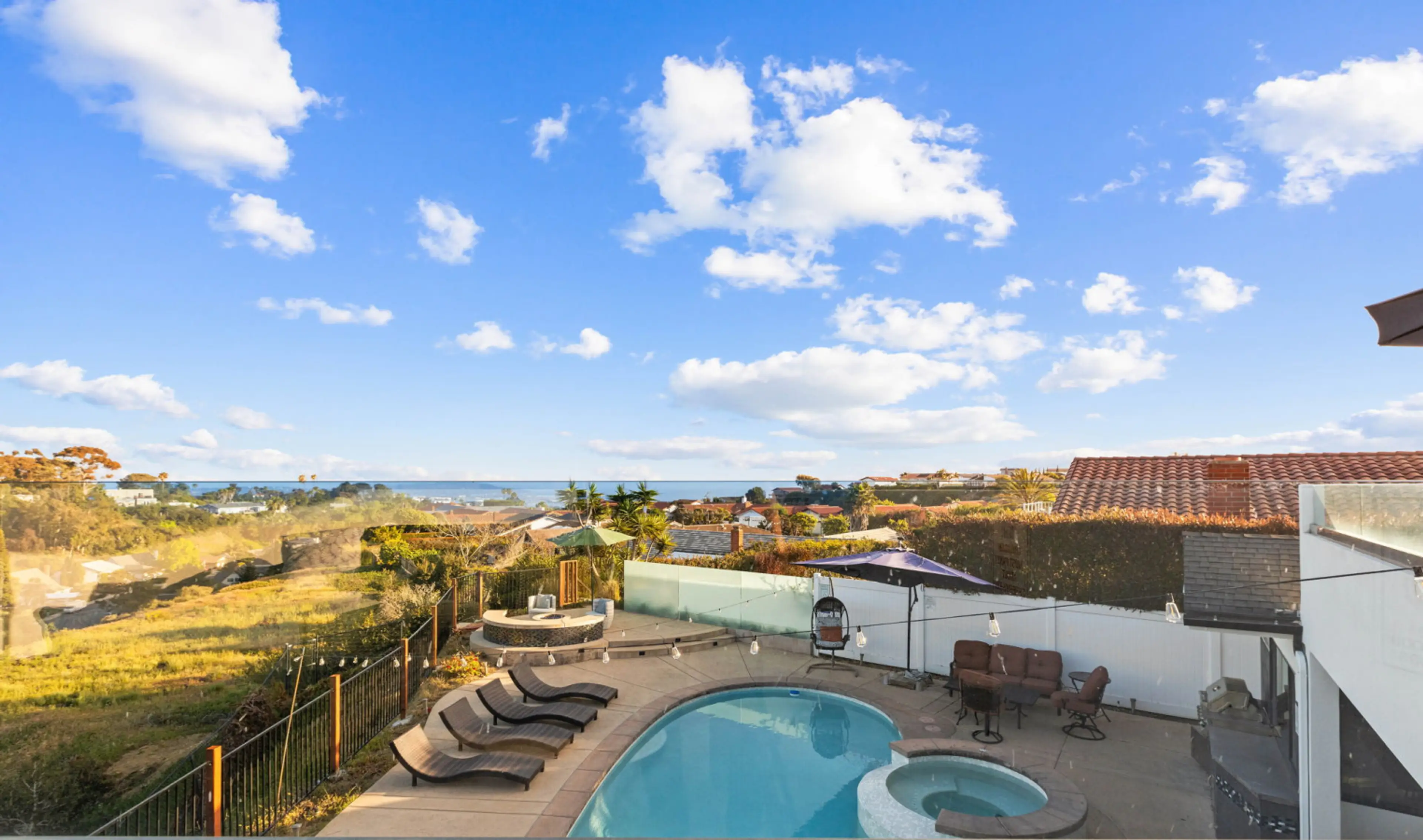Peaceful hilltop pool deck perfect for golden hour lounging.