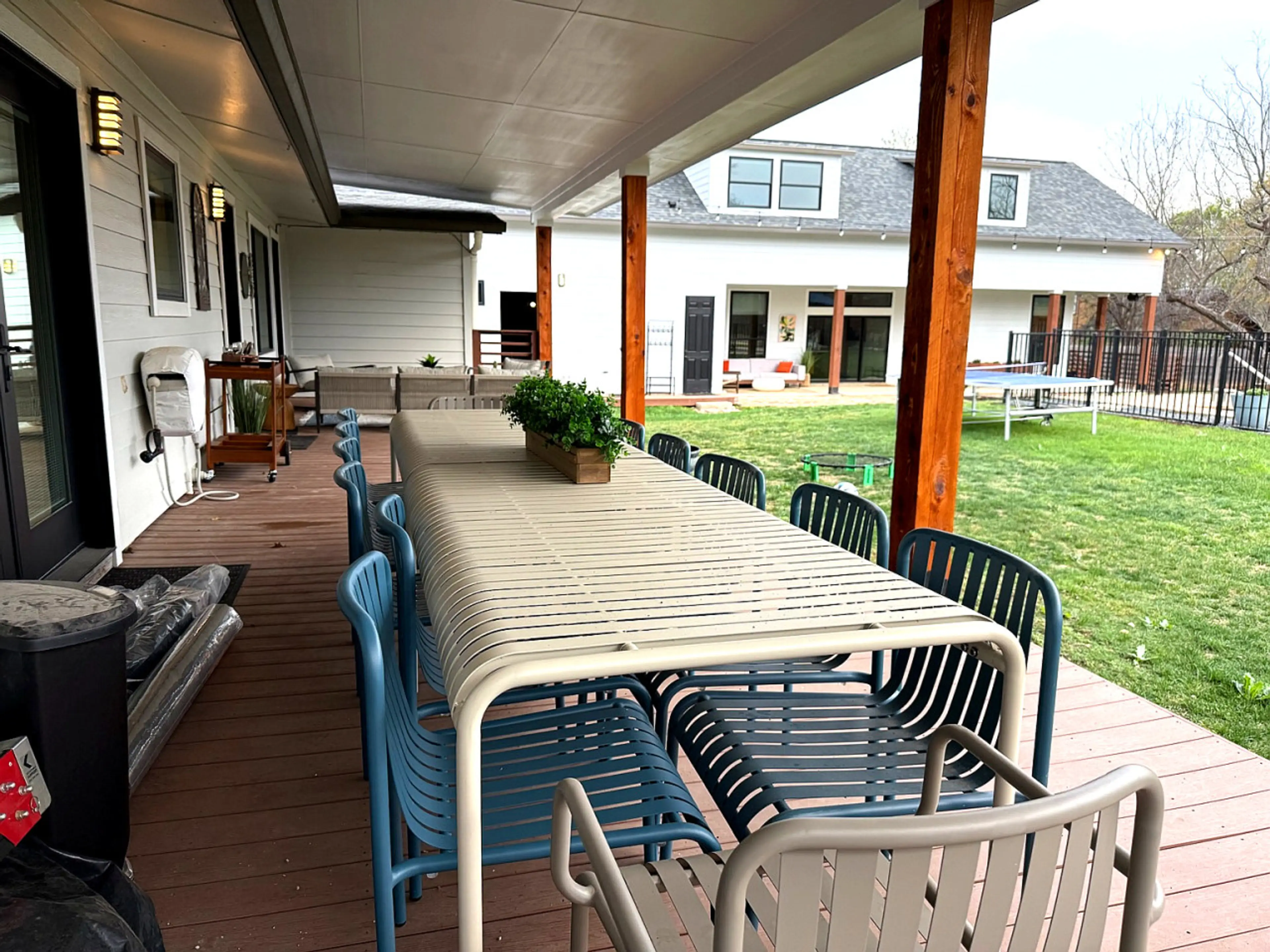 Outdoor dinning and living under one of the many covered outdoor areas on the almost acre of private estate.