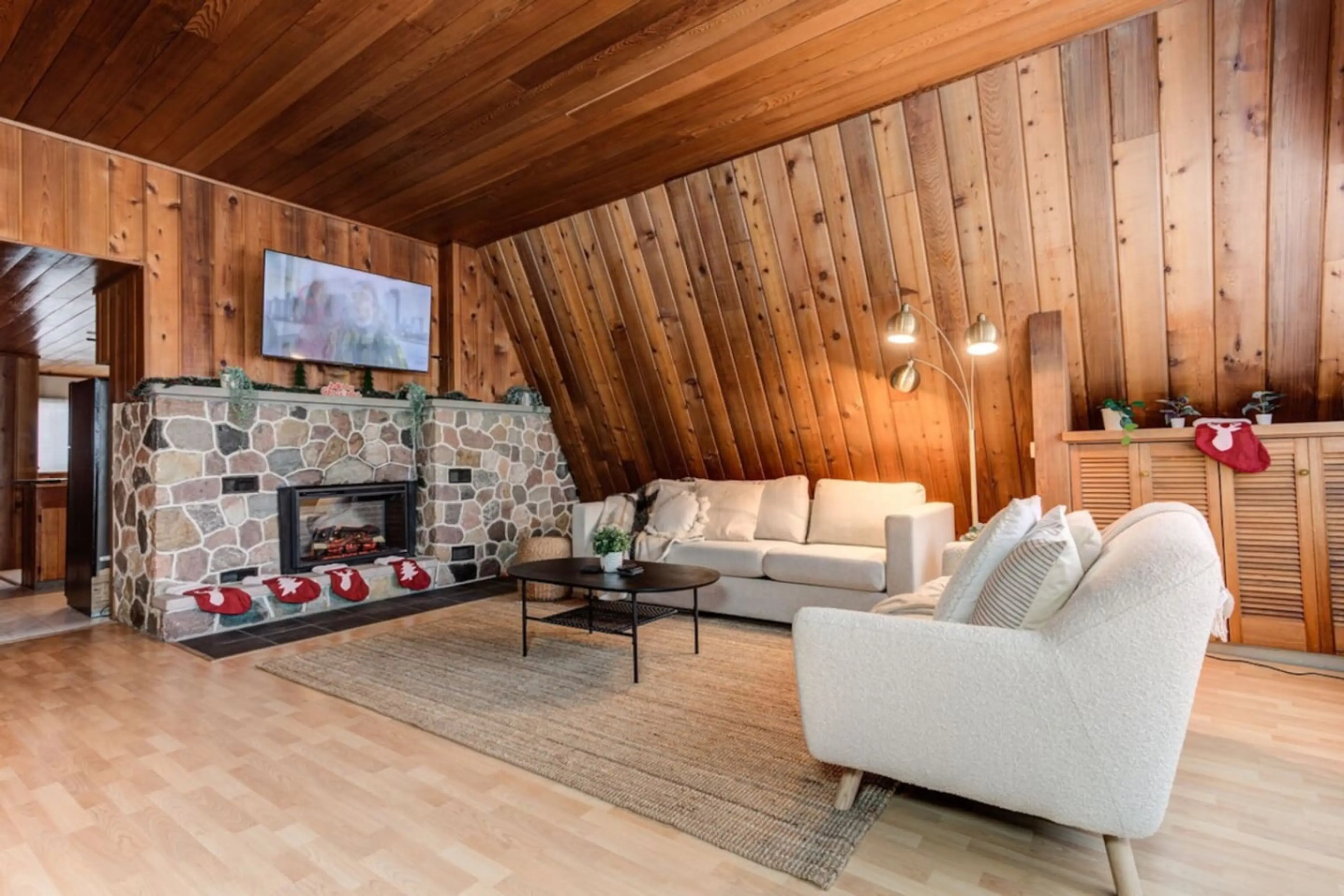 Cozy & Spacious living room with all natural wood and comfy furniture, 55inch Roku TV & Fireplace.