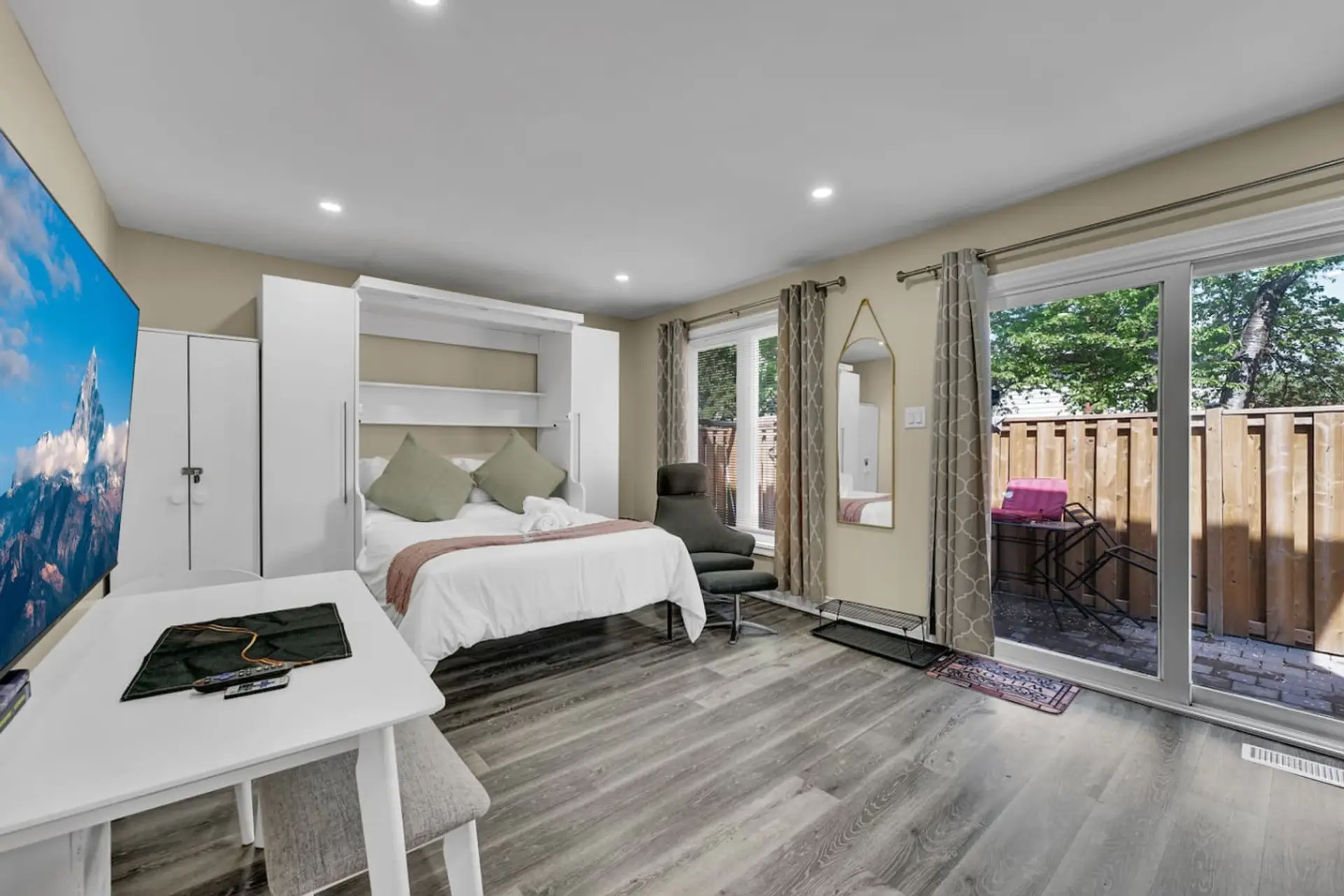 Welcome to your ultimate stay. Enjoy a comfy Queen bed, a large smart TV for streaming, a dedicated work area, and direct patio access. Your perfect compact and luxurious home base for any trip.