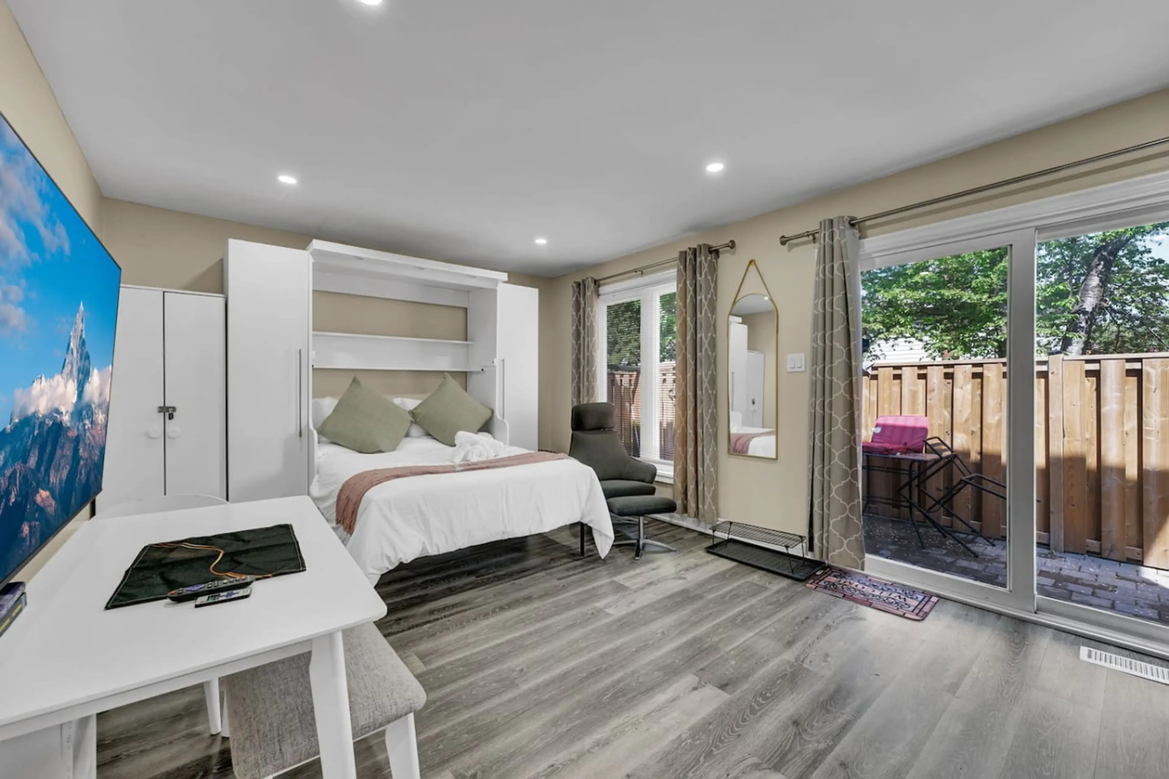 Welcome to your ultimate stay. Enjoy a comfy Queen bed, a large smart TV for streaming, a dedicated work area, and direct patio access. Your perfect compact and luxurious home base for any trip.