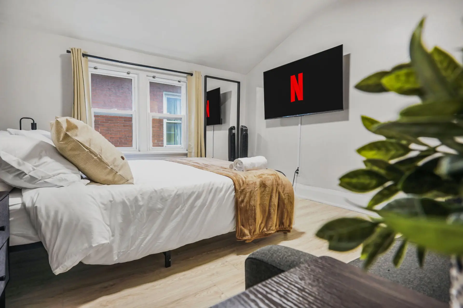 Stream your favorite shows from the comfort of this plush queen bed. Whether you are winding down after a busy day or enjoying a slow morning, this cozy retreat offers the perfect setup for ultimate relaxation and style.