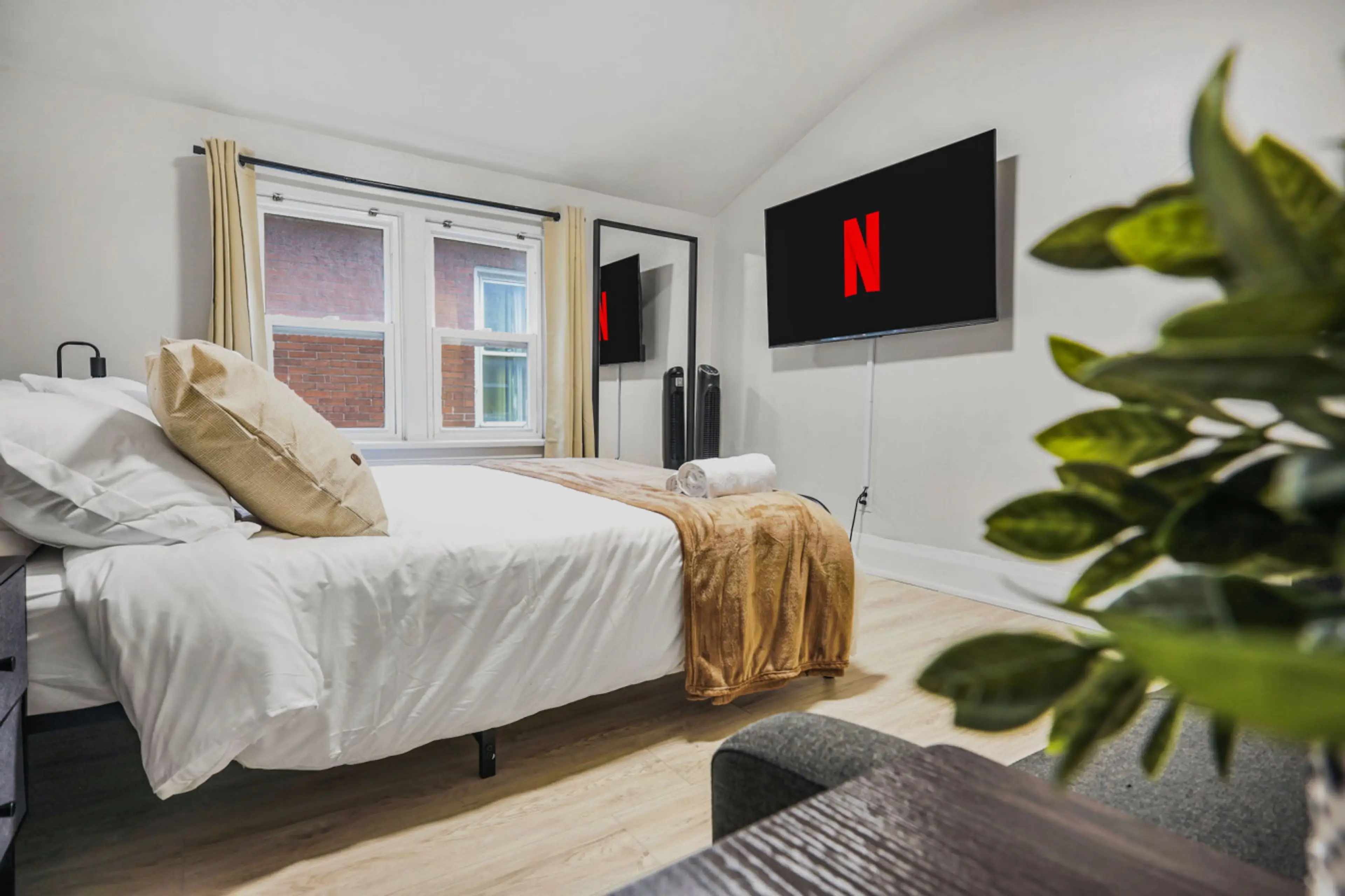 Stream your favorite shows from the comfort of this plush queen bed. Whether you are winding down after a busy day or enjoying a slow morning, this cozy retreat offers the perfect setup for ultimate relaxation and style.