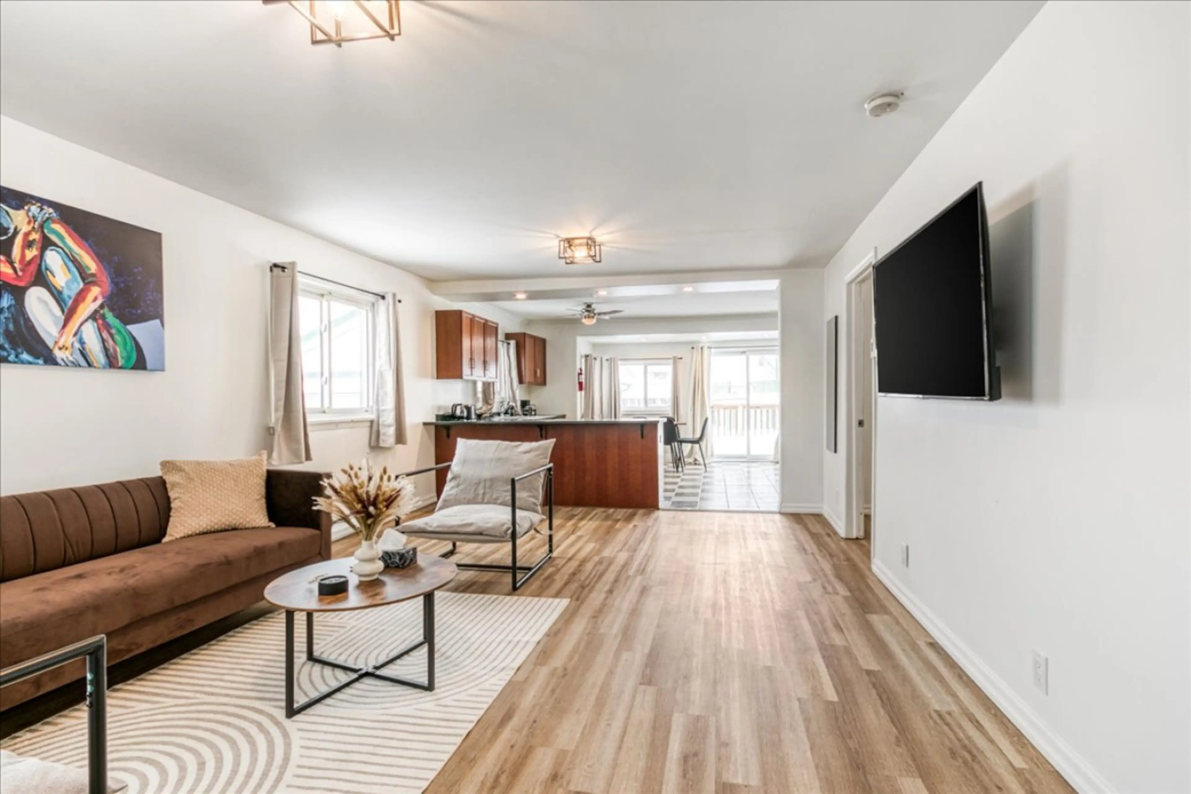 Experience an open and airy living space where modern style meets effortless flow. This bright layout is perfect for gathering, relaxing, or enjoying a movie night in a sophisticated setting. Your ideal home base awaits.