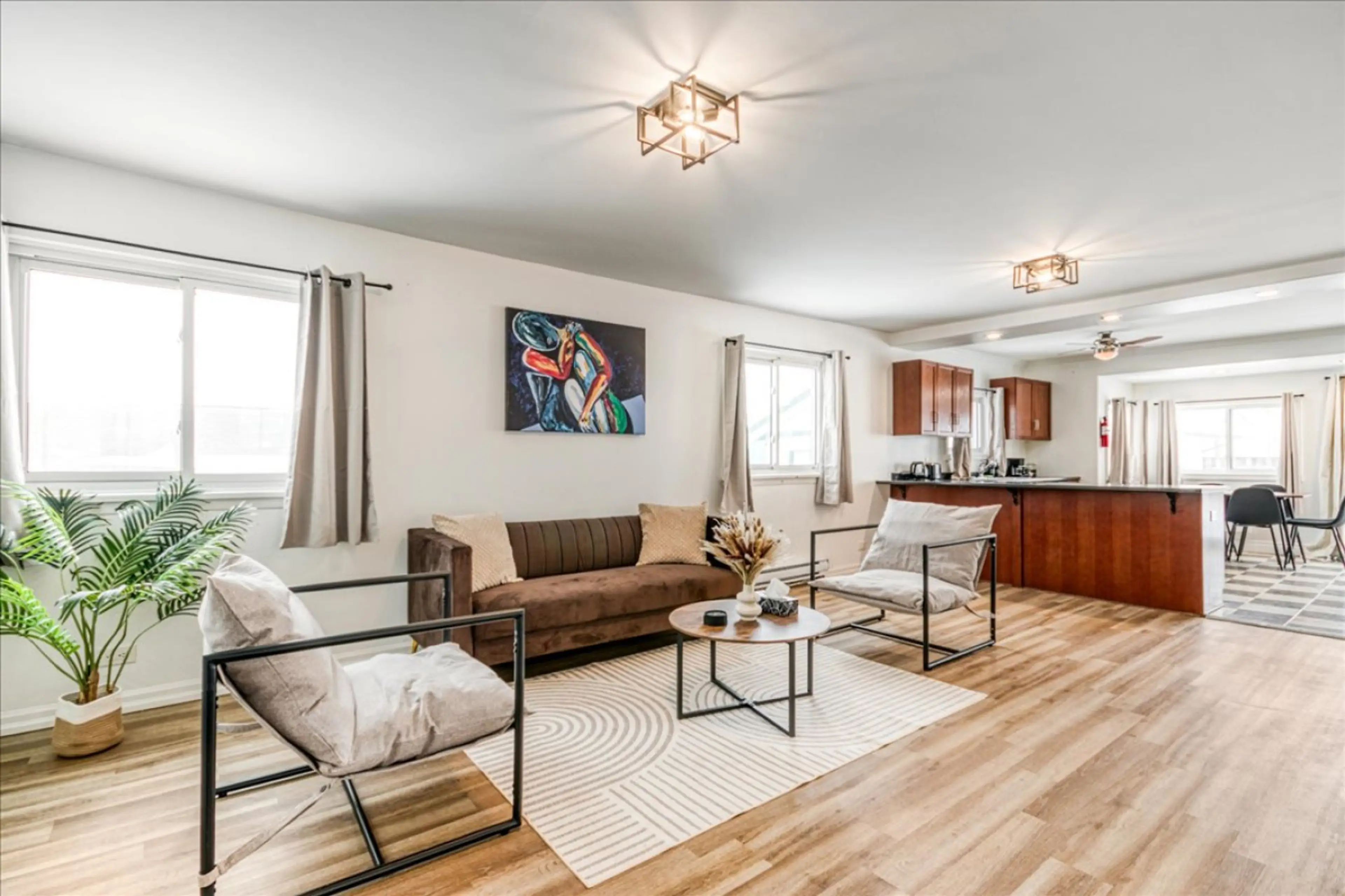 Indulge in a sophisticated atmosphere where artistic flair meets seamless functionality. This expansive living area serves as an elegant backdrop for both quiet reflection and lively conversation. Elevate your travel experience.