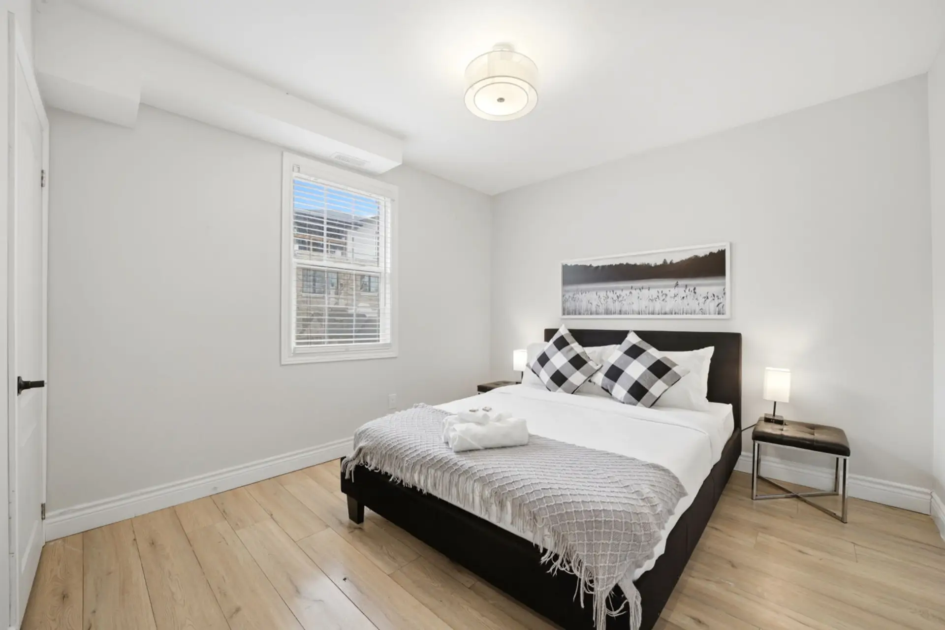 Unwind in a serene sanctuary designed for ultimate relaxation. This bright and airy bedroom provides a peaceful atmosphere for a restful night of sleep, ensuring you wake up refreshed and ready for the day ahead.