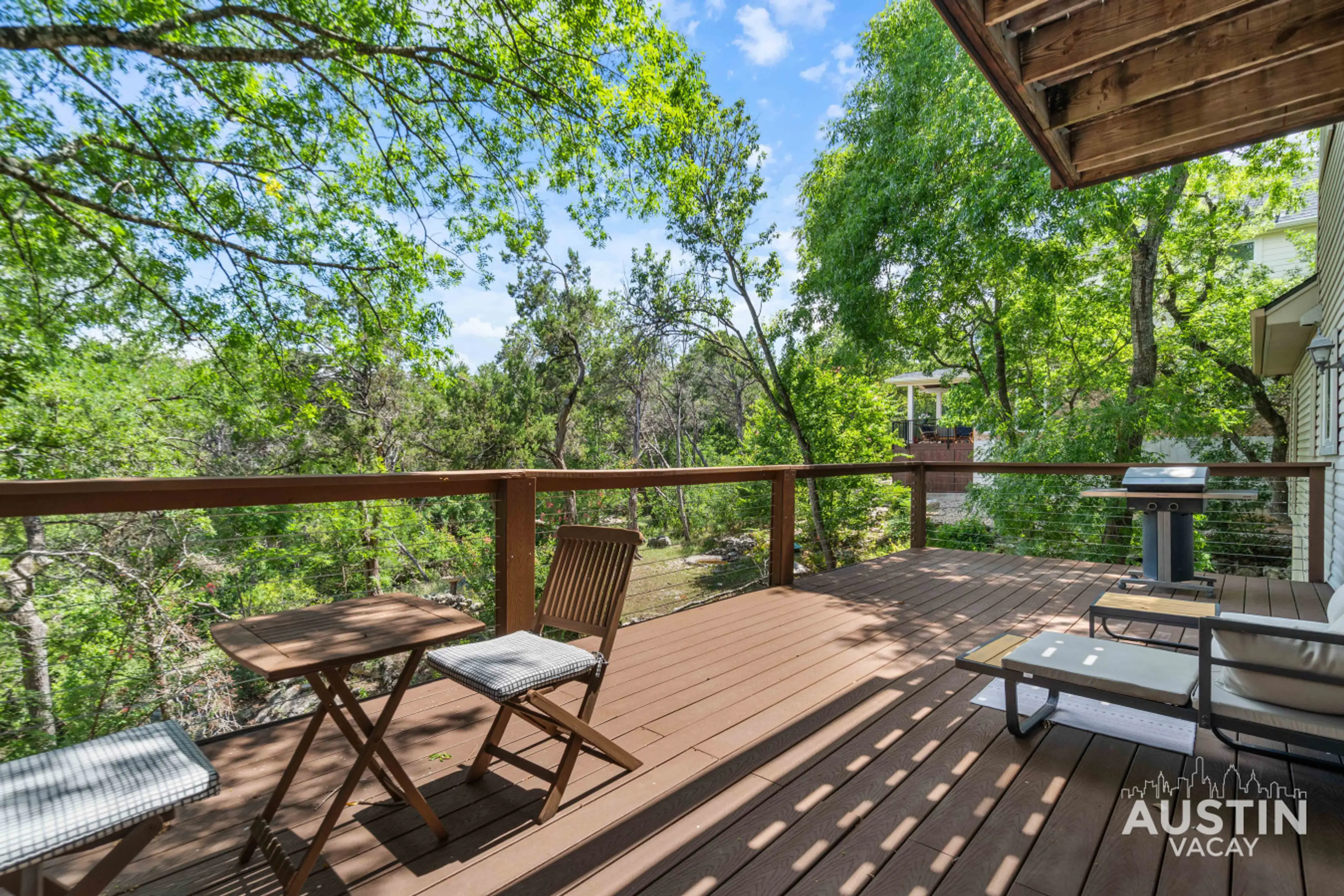 On the balcony: wind whispers, leaves hum, and your coffee companion might just be the breeze.