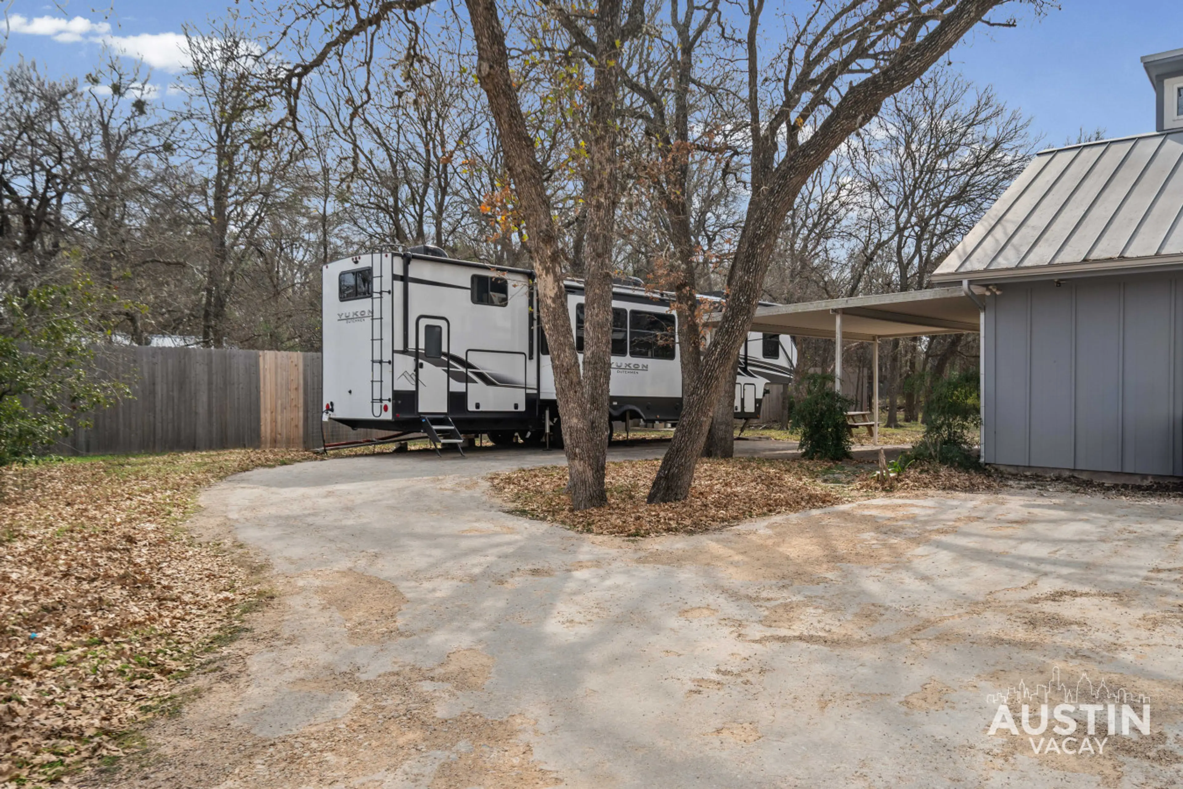 Your home on wheels, parked and ready—trees included.