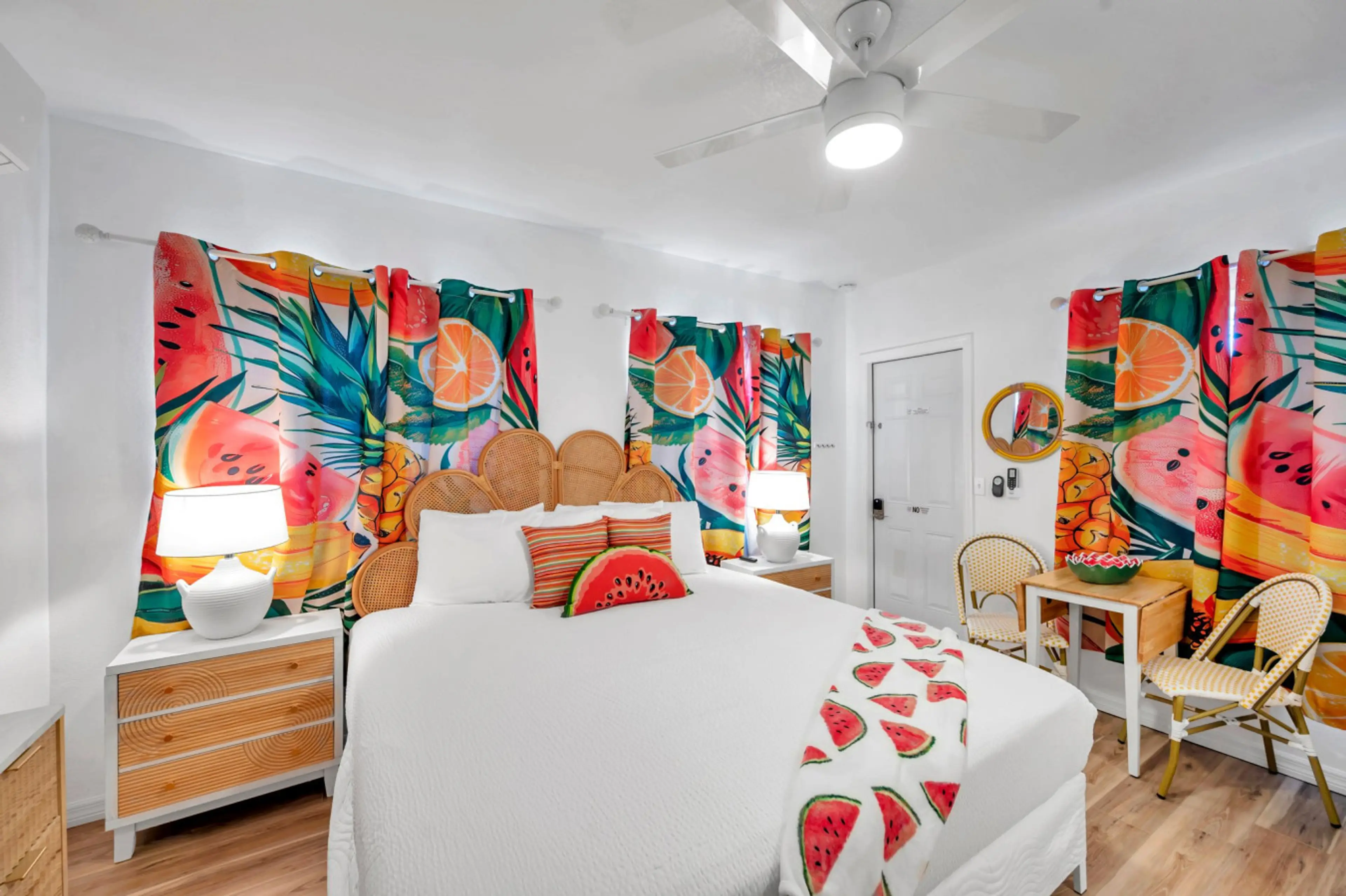 Colorful bedroom w/ vibrant wall art, bold textiles & a fun, lively vibe