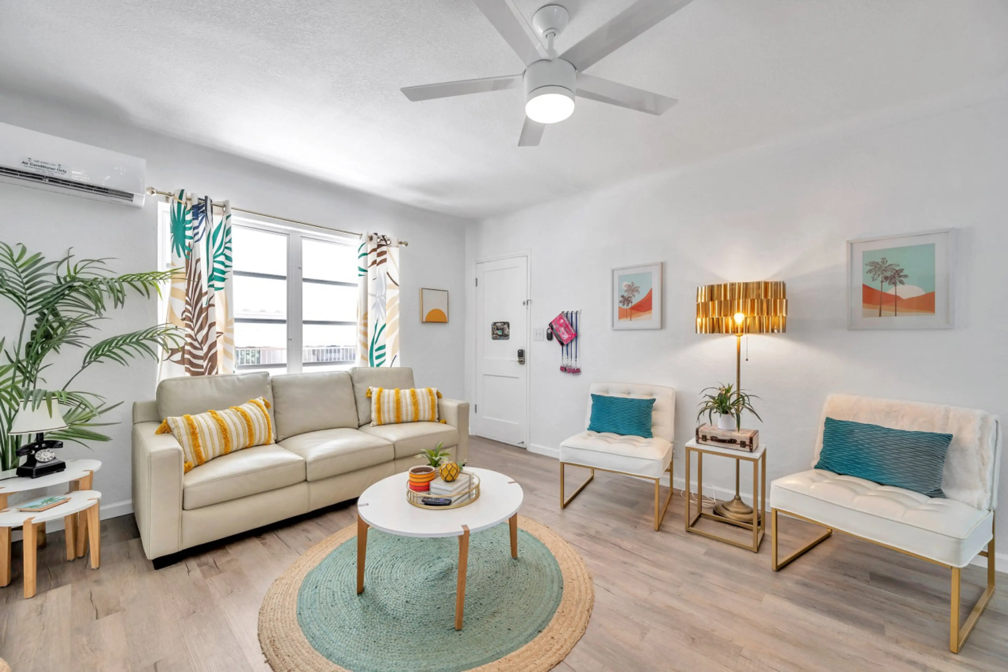 Bright open living space w/ cozy seating, cheerful accents, & plenty of room to relax together