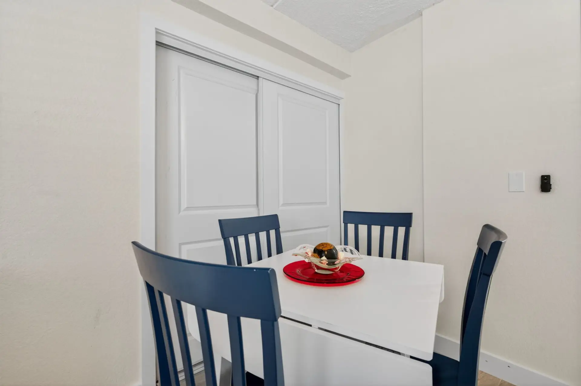 Cozy dining nook w/ modern chairs, ideal for casual meals or morning coffee