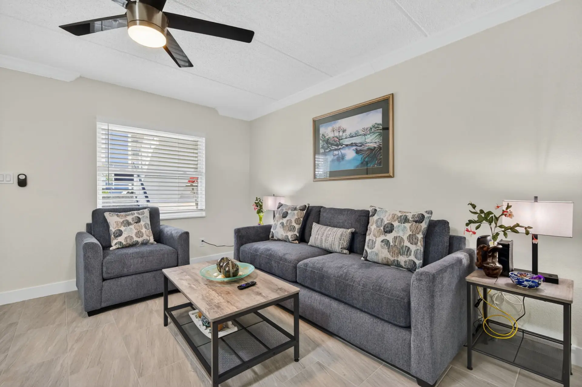 Inviting living room w/ plush seating, warm decor & a relaxed setup perfect for unwinding after a full day.