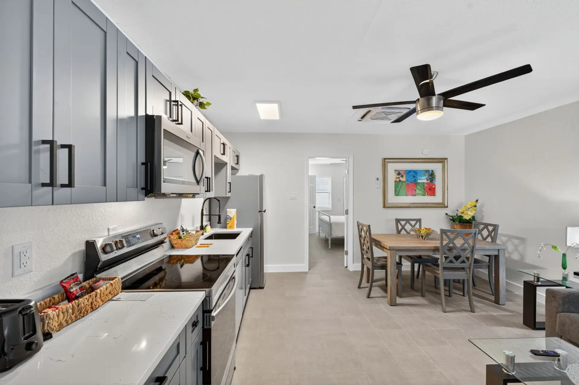 Open kitchen & dining area w/ bright lighting and an easy, social layout
