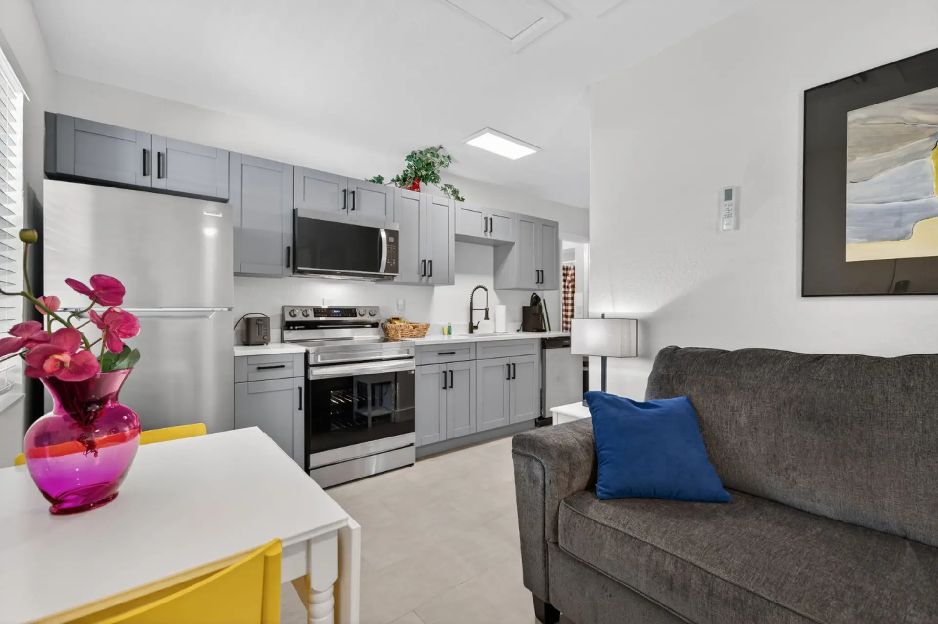 Open living & kitchen view w/ inviting seating and a relaxed, homey feel