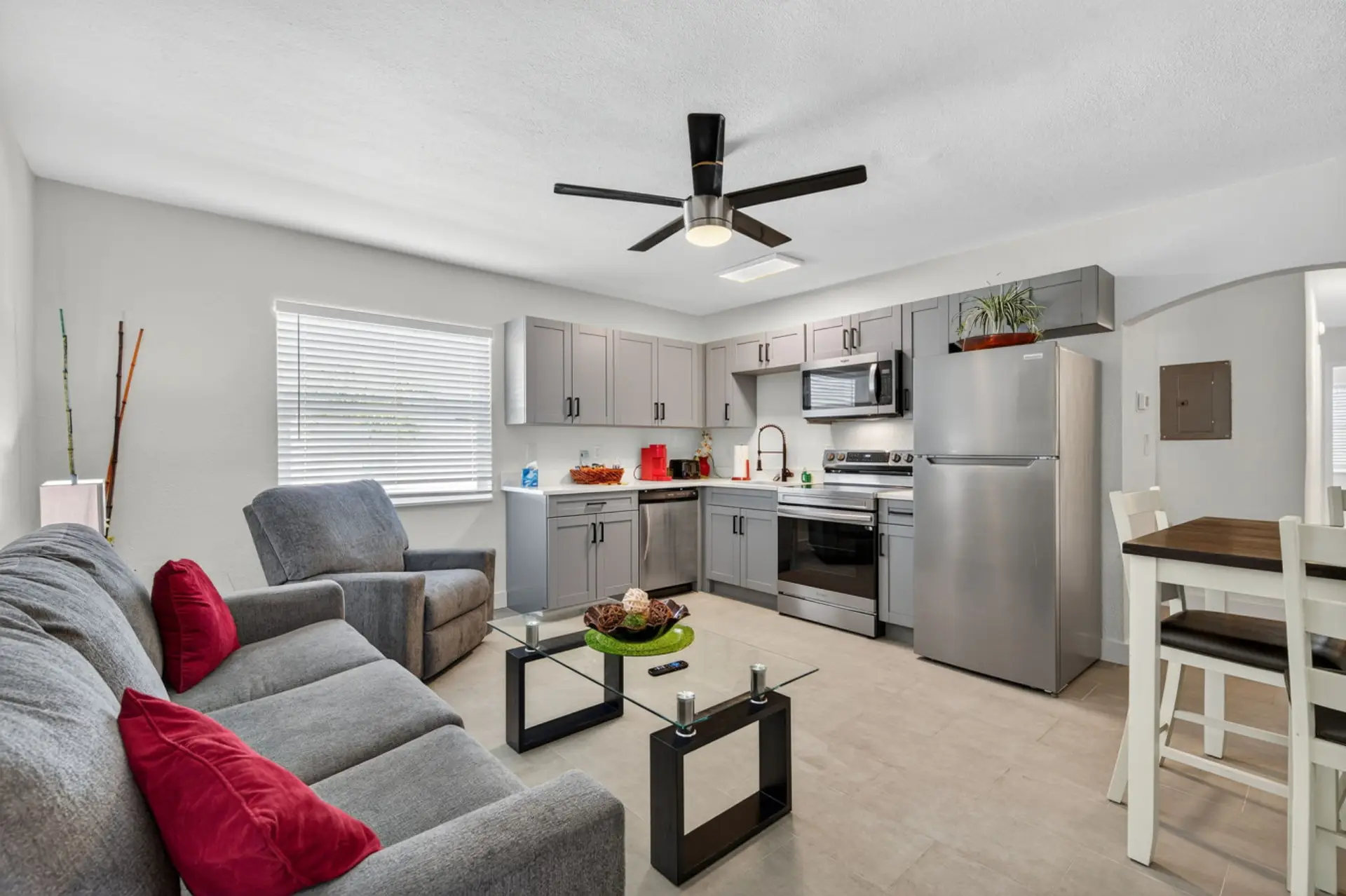 Fully renovated living space w/ open layout, modern finishes, and inviting seating.