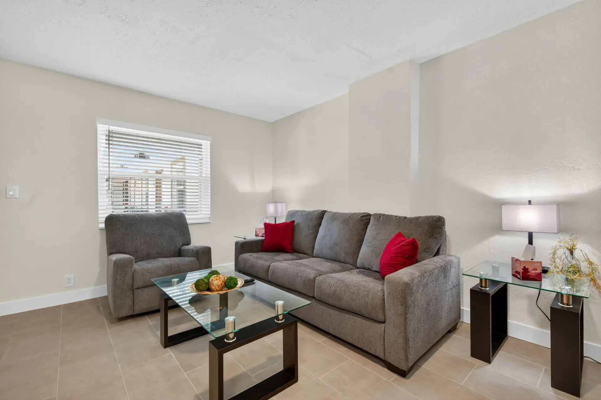 Cozy living area w/ comfortable seating, bright accents, and an inviting spot to unwind.
