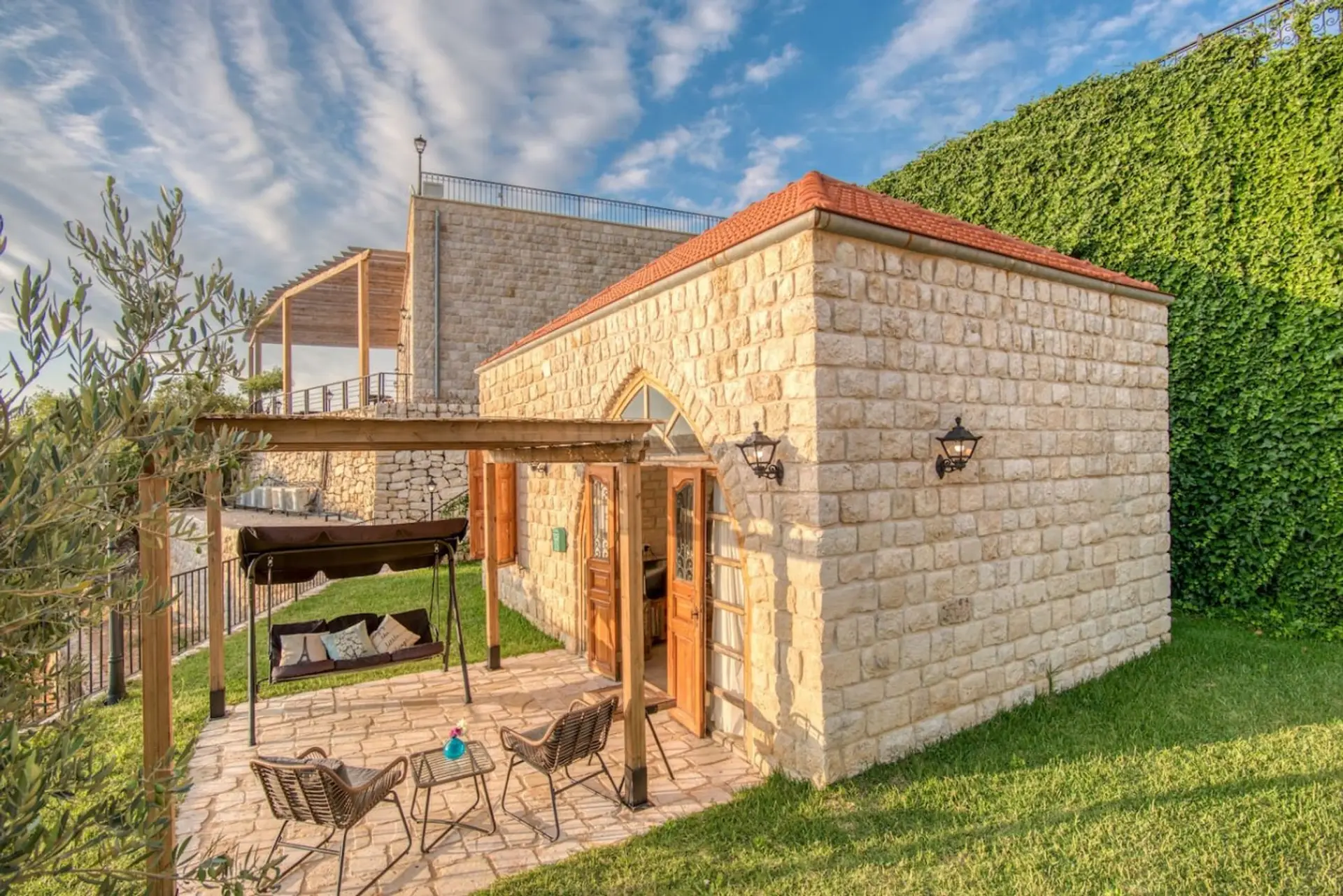 Private patio with a pergola and outdoor seating