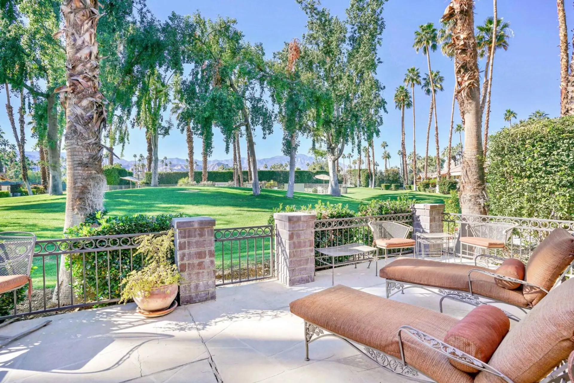 Patio with lounge chairs and a view