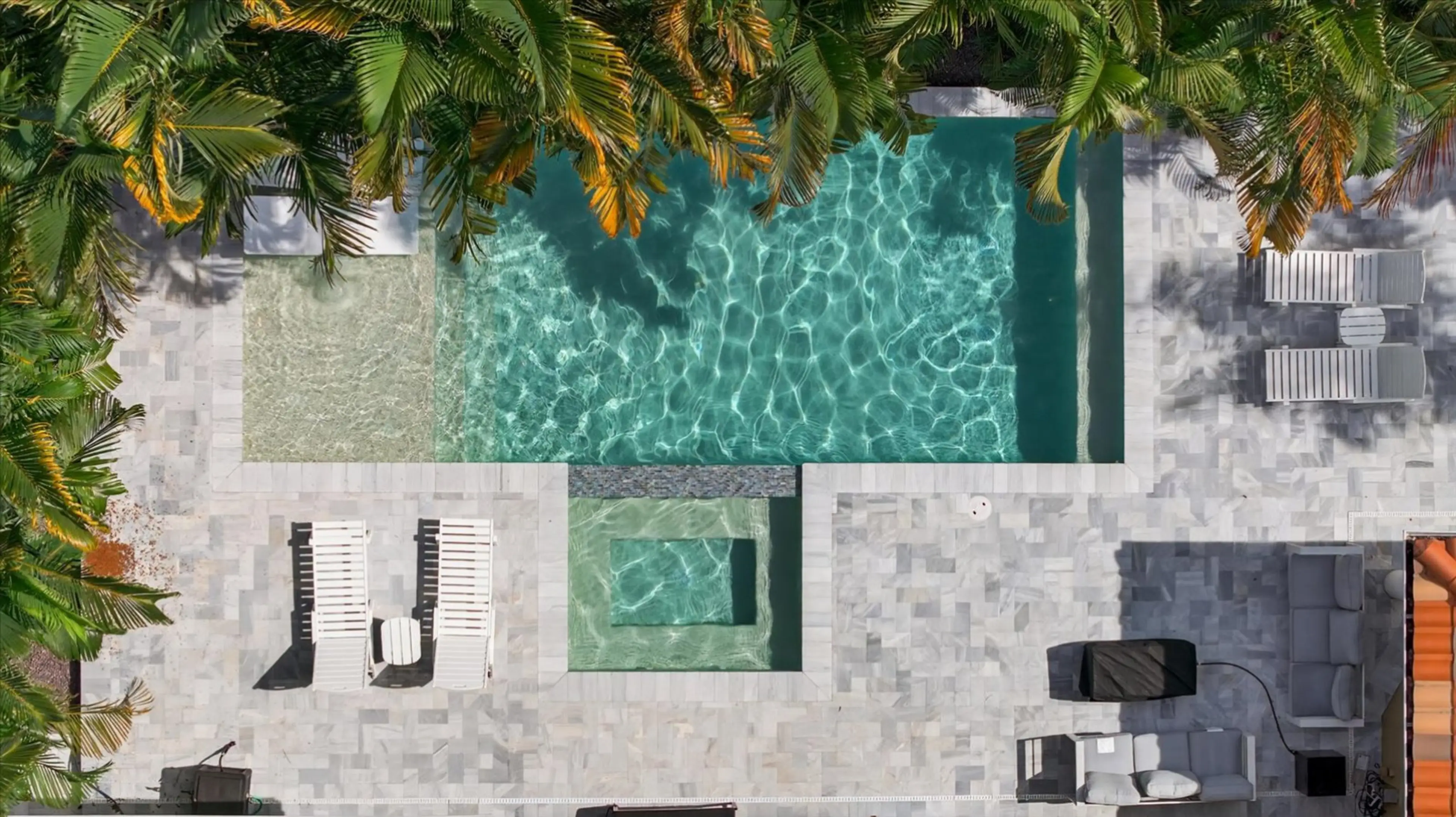 Secluded backyard oasis with heated pool and loungers