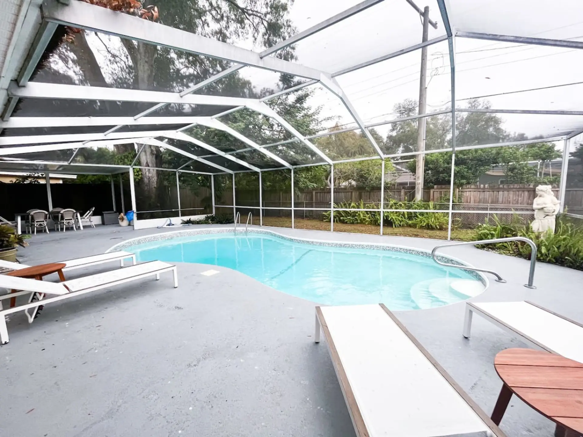 Bright, Blue Pool Fully Enclosed w/ Comfy Sun Loungers & Tropical Plant Life