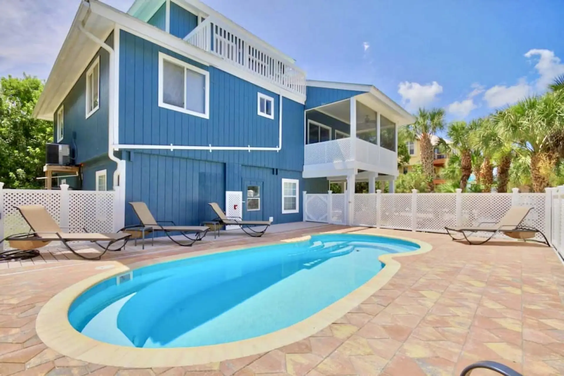 Soak up the Florida sunshine by your private heated pool surrounded by tropical palms and privacy fencing.