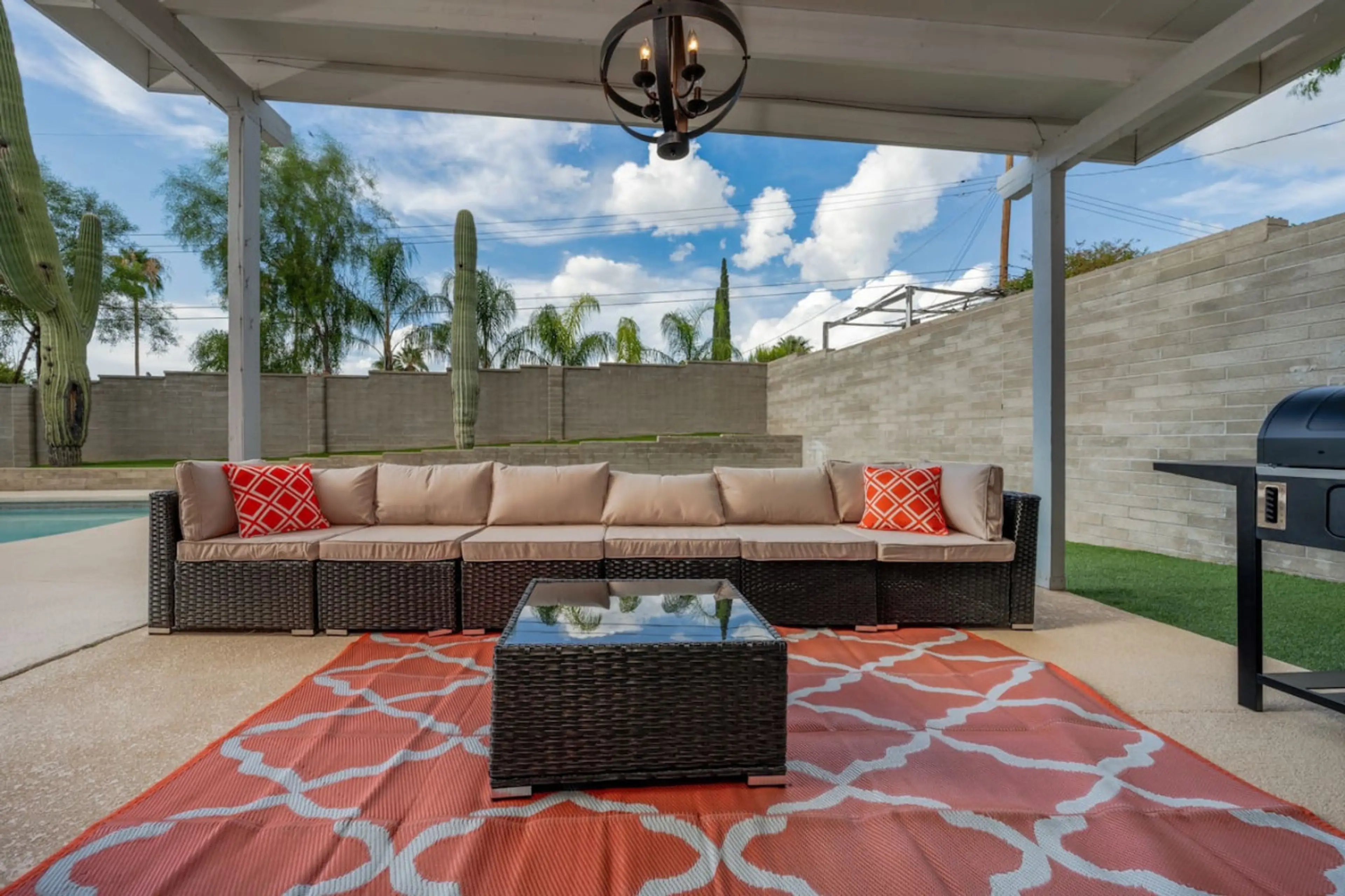 Backyard patio with grill and comfortable seating