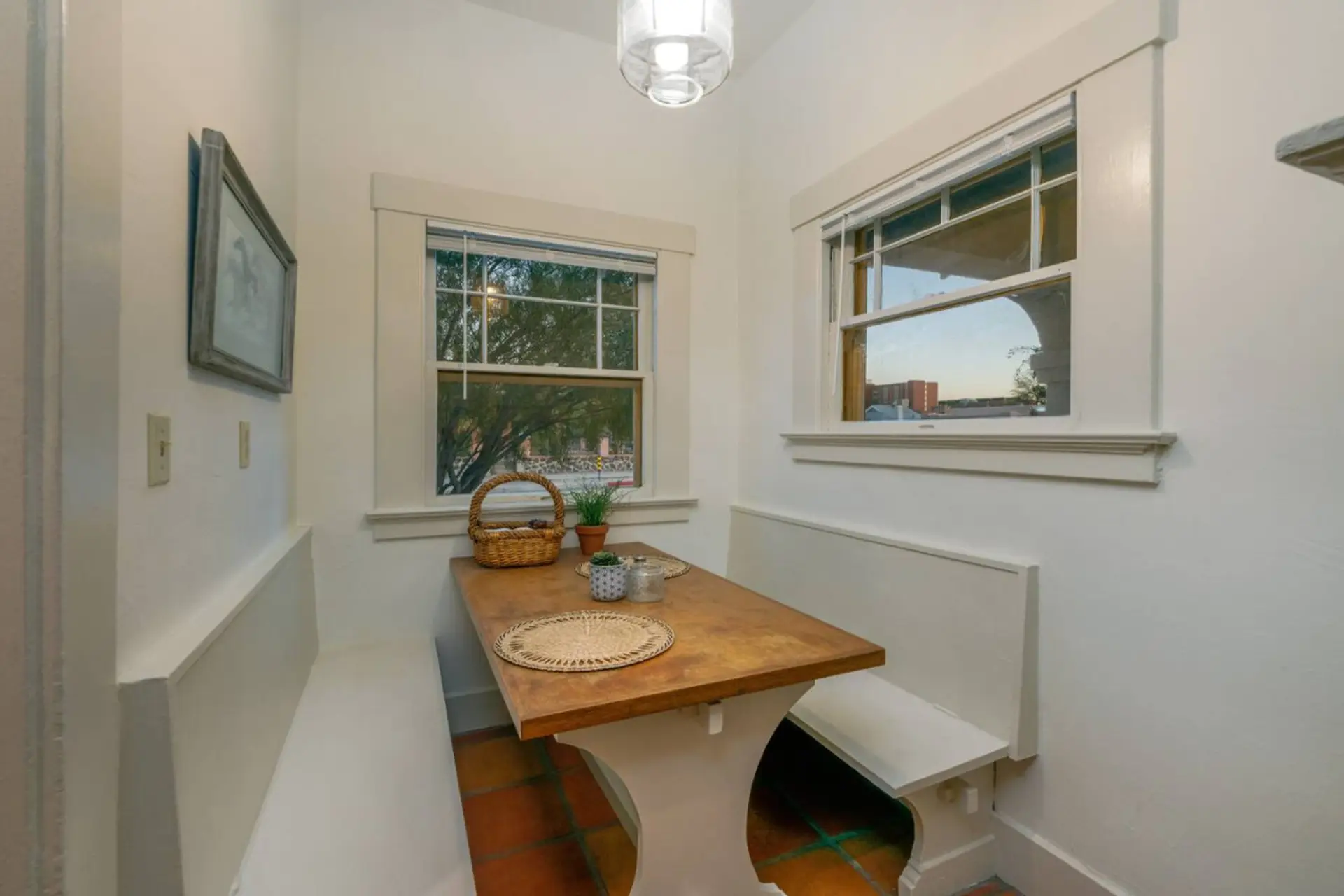 Sunny breakfast nook doubles as a workspace — ideal for laptop work, emails, and video calls with plenty of natural light. (Note that seating is bench-style, so it's better suited to shorter work sessions than full 8-hour days.)