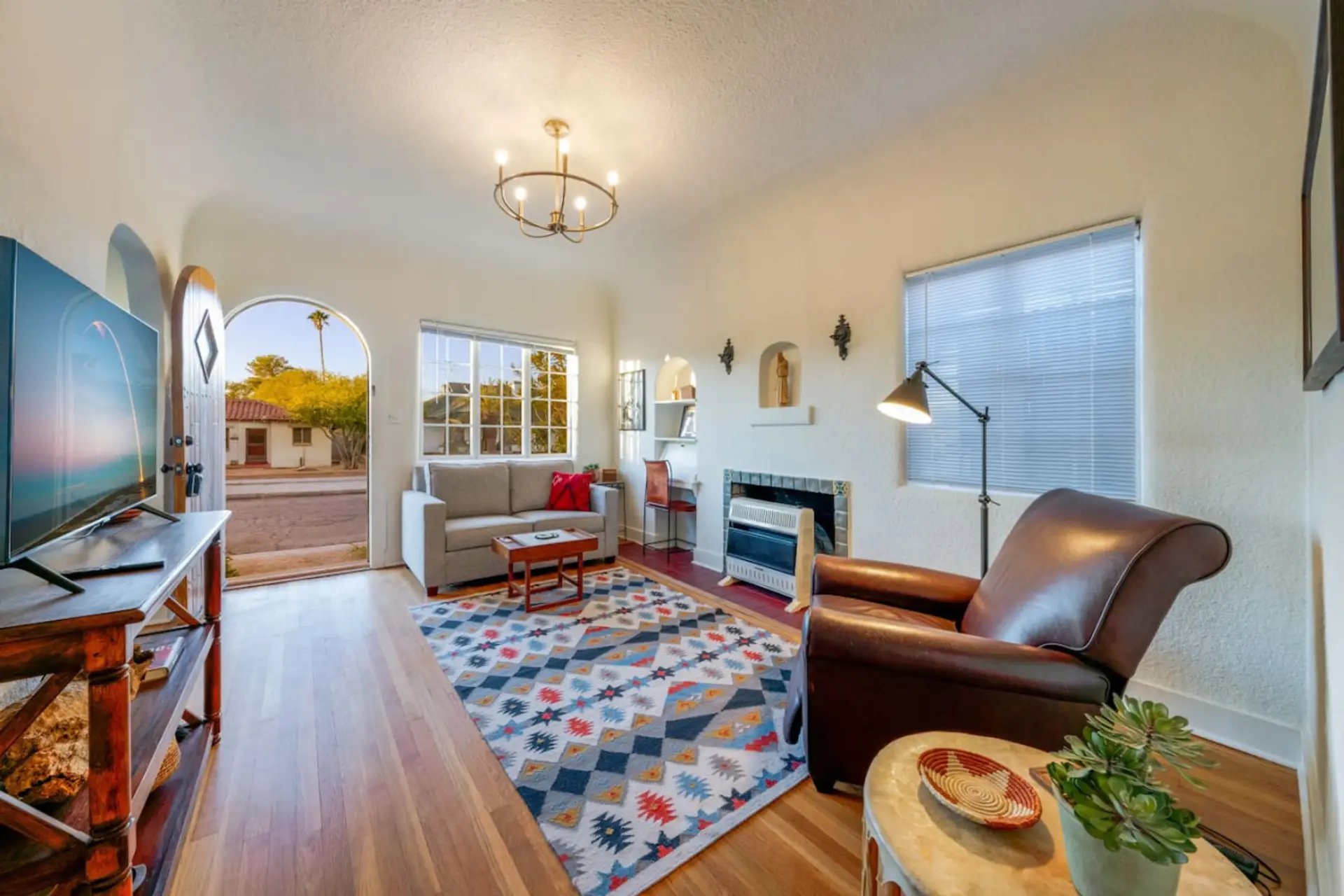 Bright living room with sleeper sofa and smart TV