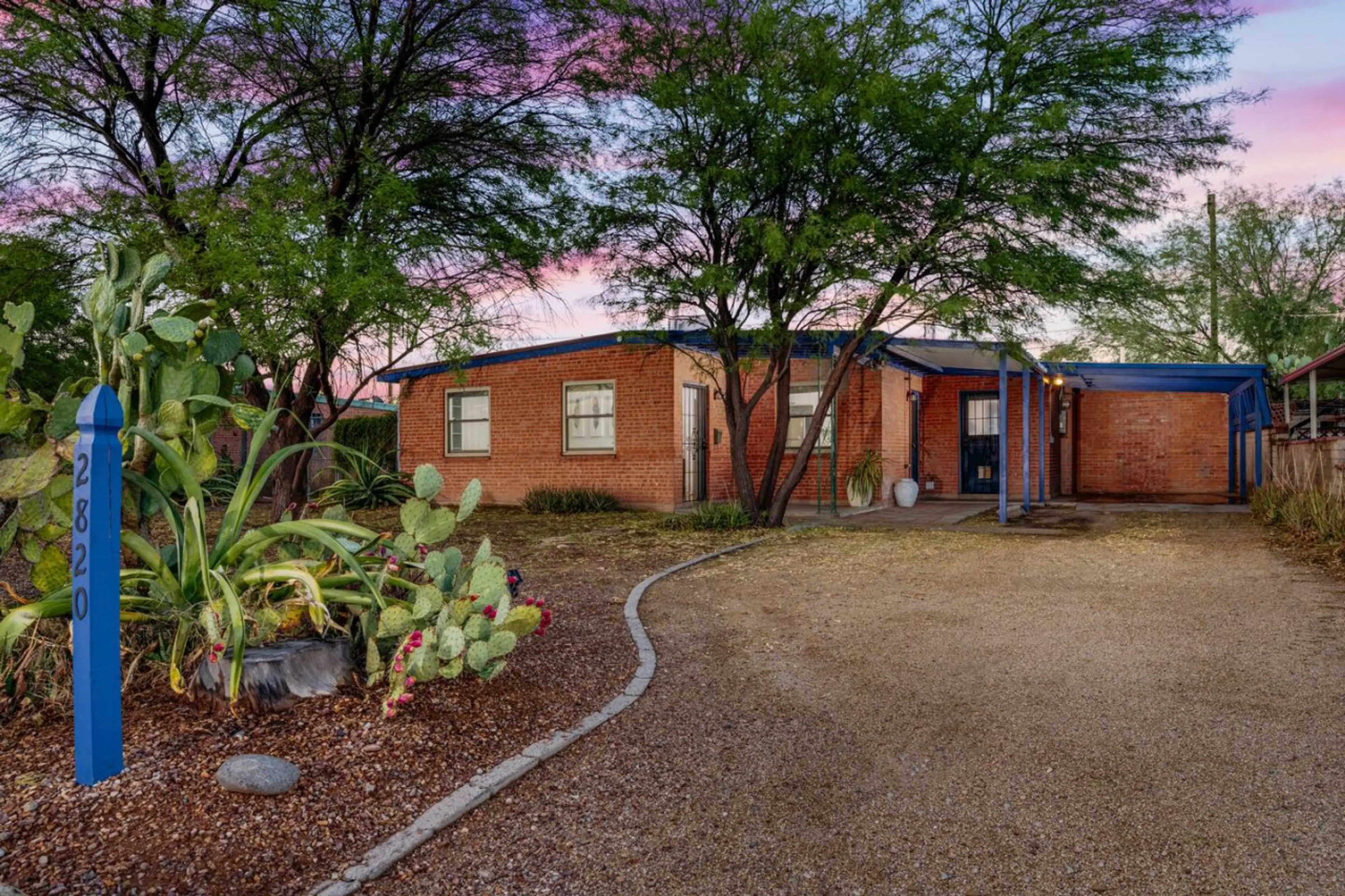 Charming three-bedroom, two-bath classic Tucson home with covered parking for one car, and uncovered parking for two more