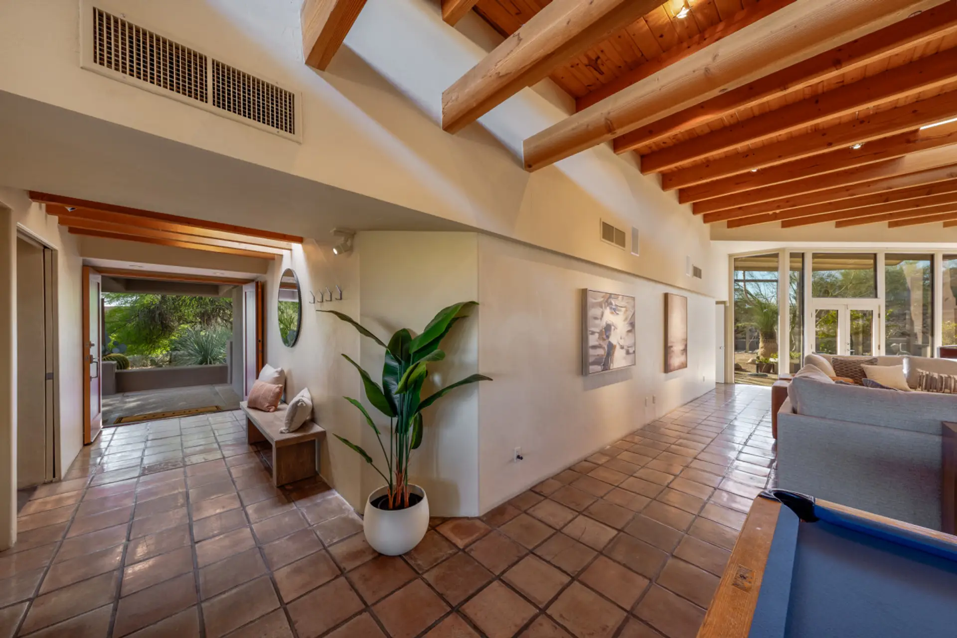 Step inside to soaring wood-beamed ceilings, spacious gathering areas, and seamless indoor-outdoor living