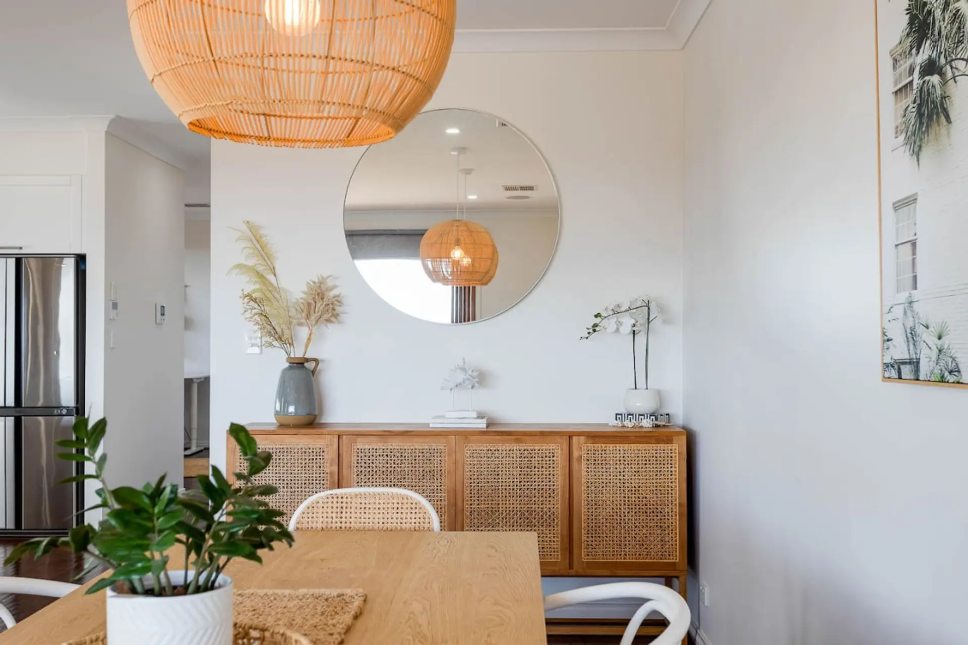 The sleek and modern design of the living room diner area makes it a perfect hub for family gatherings and casual entertaining.
