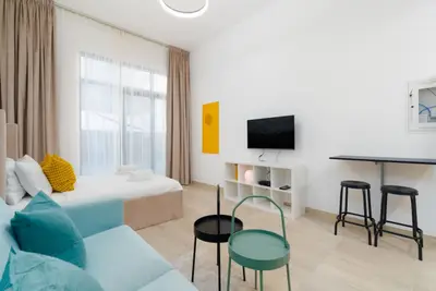 The sleeping and lounge area seen beside the tall bar table