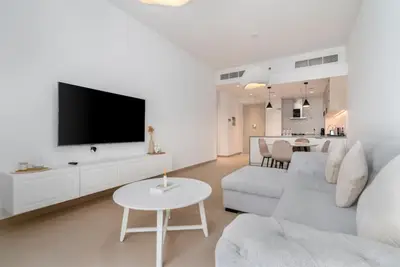 Another look at the lounge, sofa facing the TV with the dining nook behind