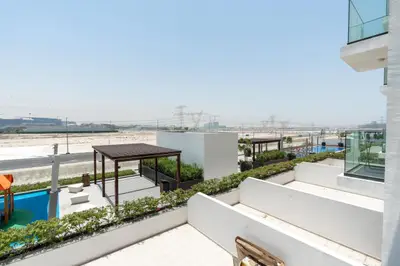 Terrace view over pergolas, hedges and the open desert horizon