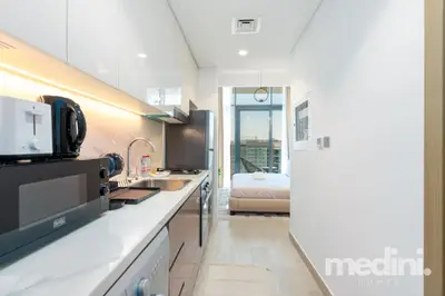 Sleek kitchen counter looking through to the sleeping area