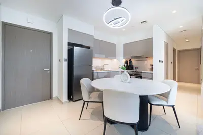 Dining area for four beside the kitchen, right at the apartment entrance