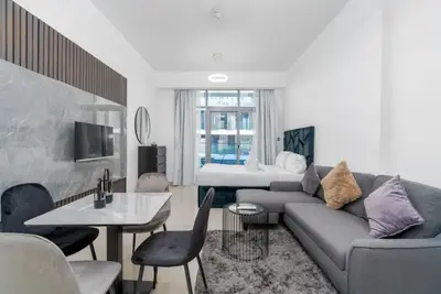 Another view of the studio showing the seating area and bed