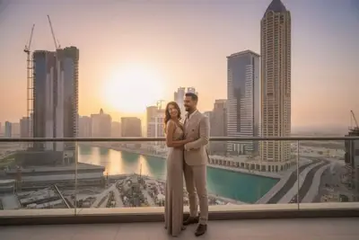 Rooftop terrace at sunset with skyline and waterway visible in the background