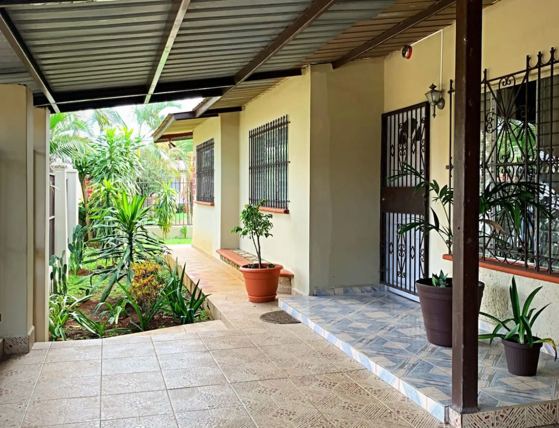 Gated Front Entrance with Lush Landscaping.