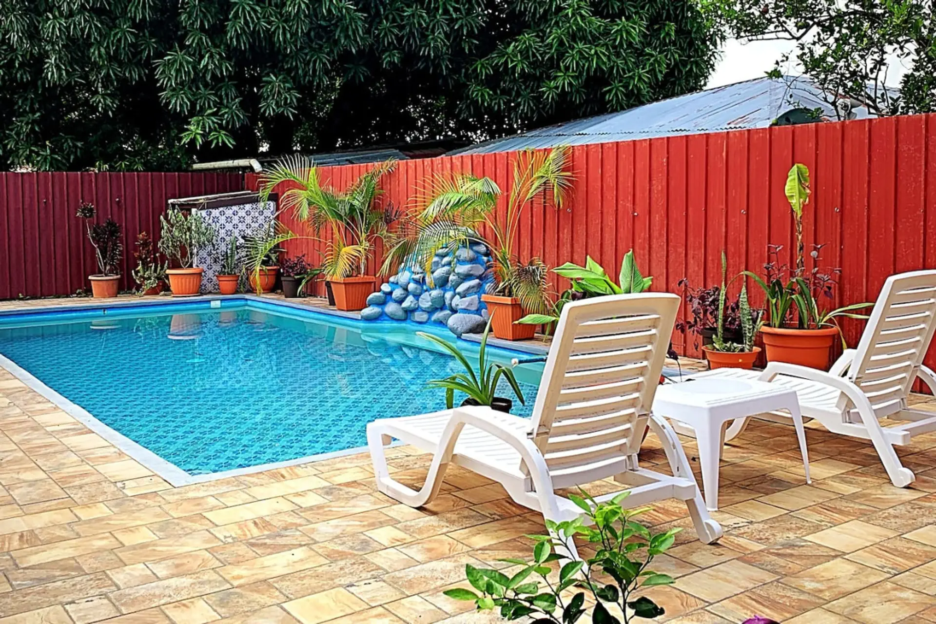 Pool with Waterfall and Lounge Chairs.