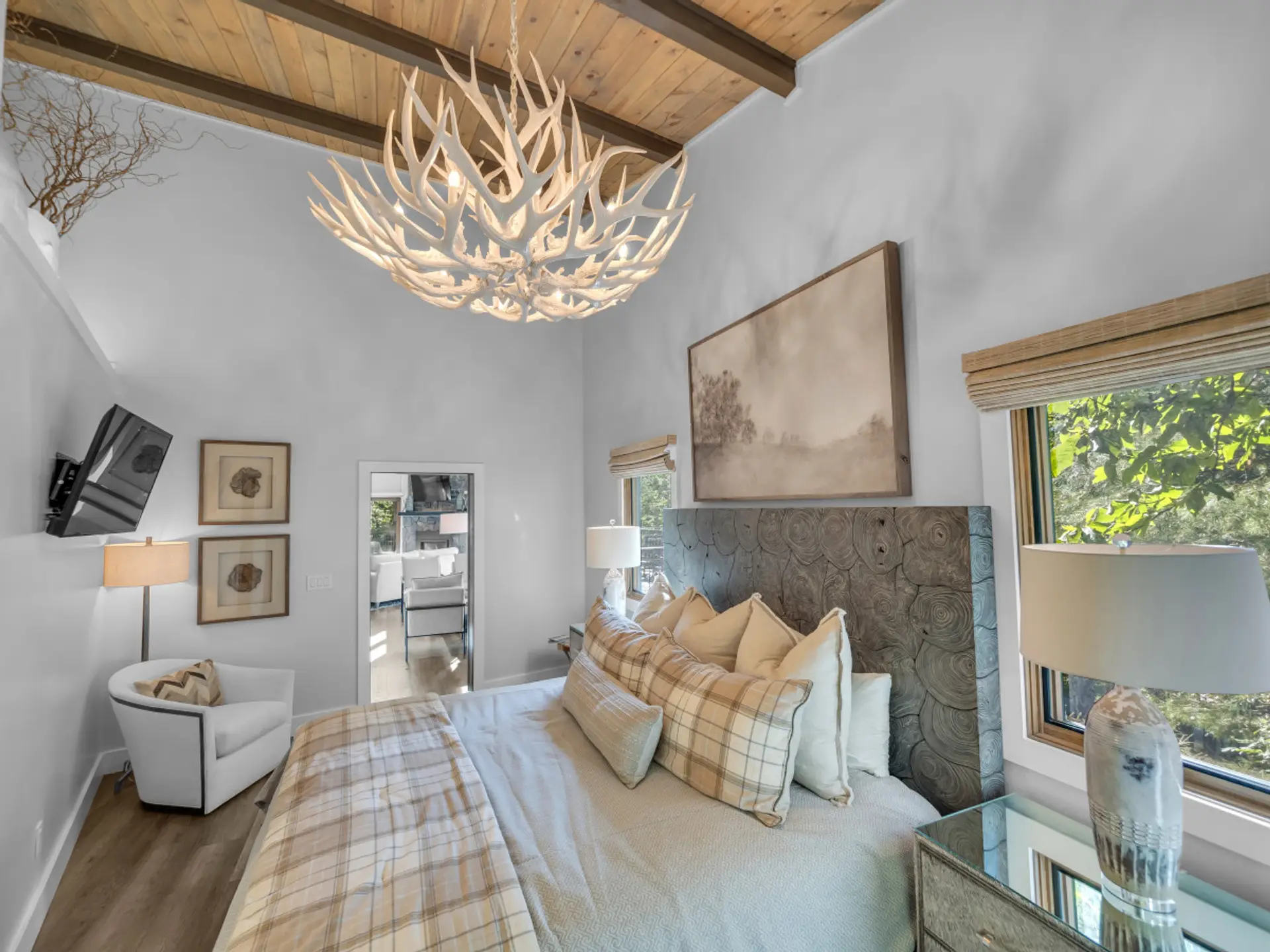 Master Bedroom on First Floor, large chandelier, smart TV, King size bed