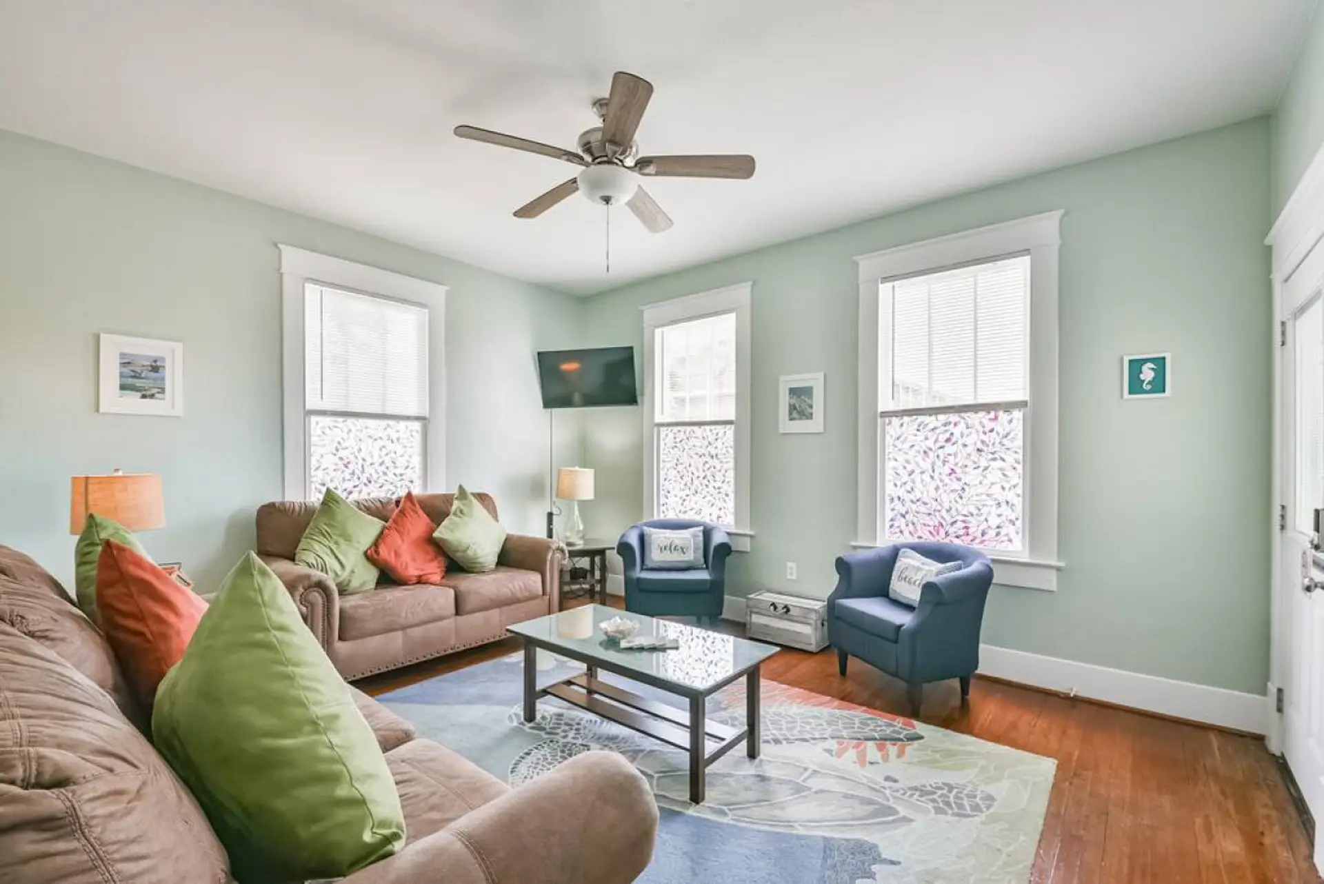 Another view of the cute living room, great natural light exposure!